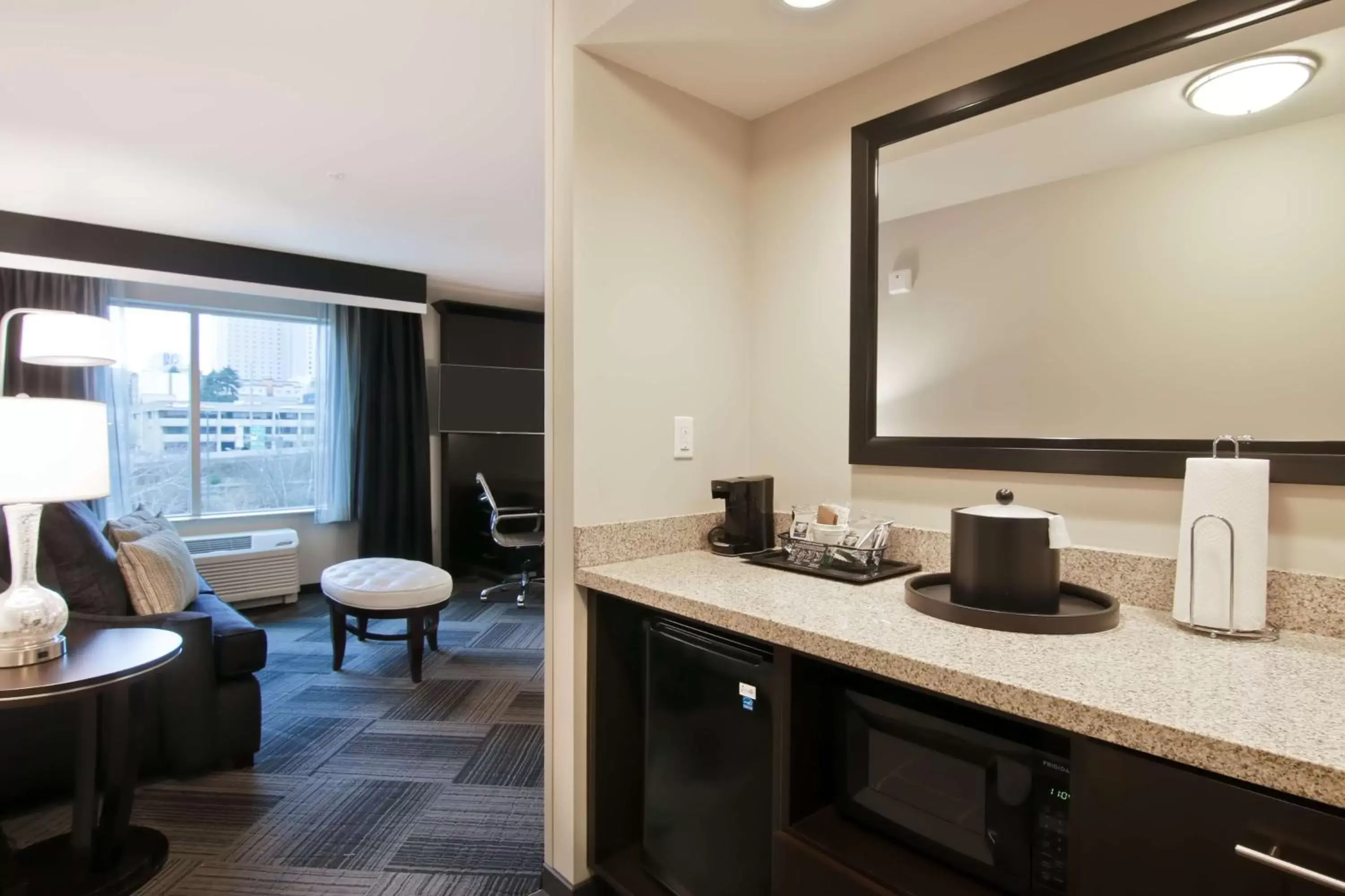 Living room, Bathroom in Hampton Inn & Suites Bellevue Downtown/Seattle