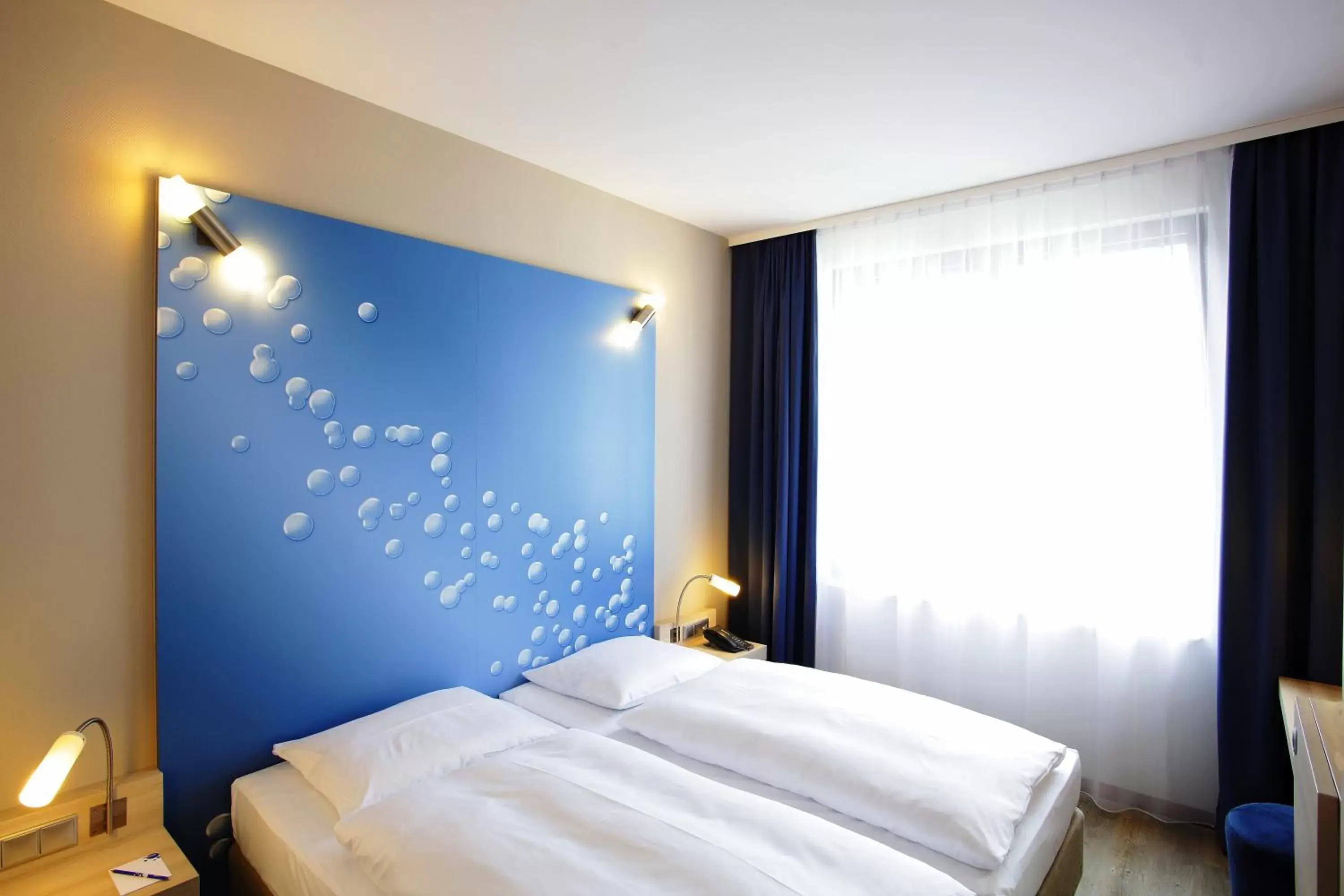 Bed in H2 Hotel Berlin-Alexanderplatz Bed in H2 Hotel Berlin-Alexanderplatz