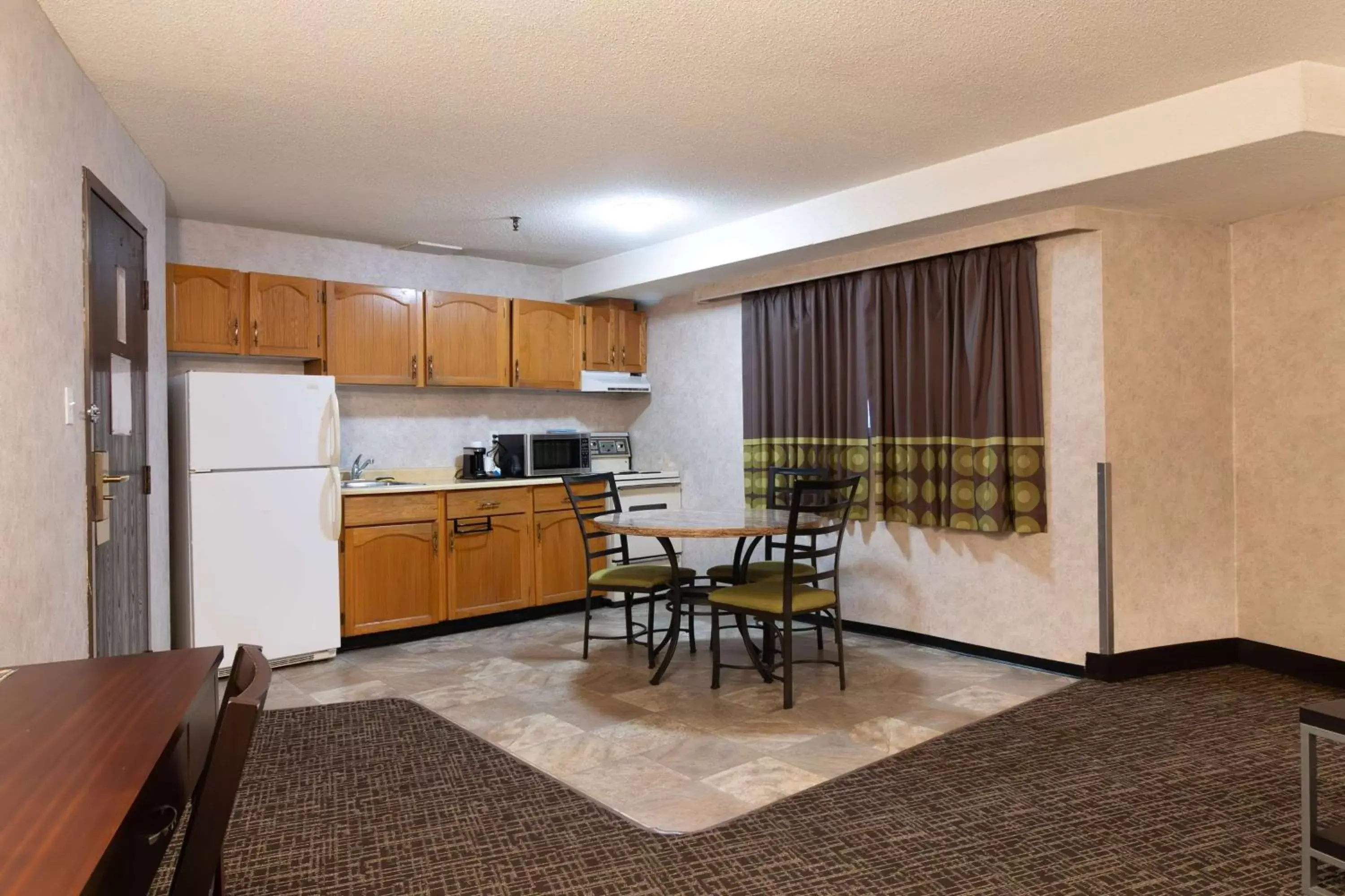 Photo of the whole room, Kitchen/Kitchenette in Super 8 by Wyndham Prince George