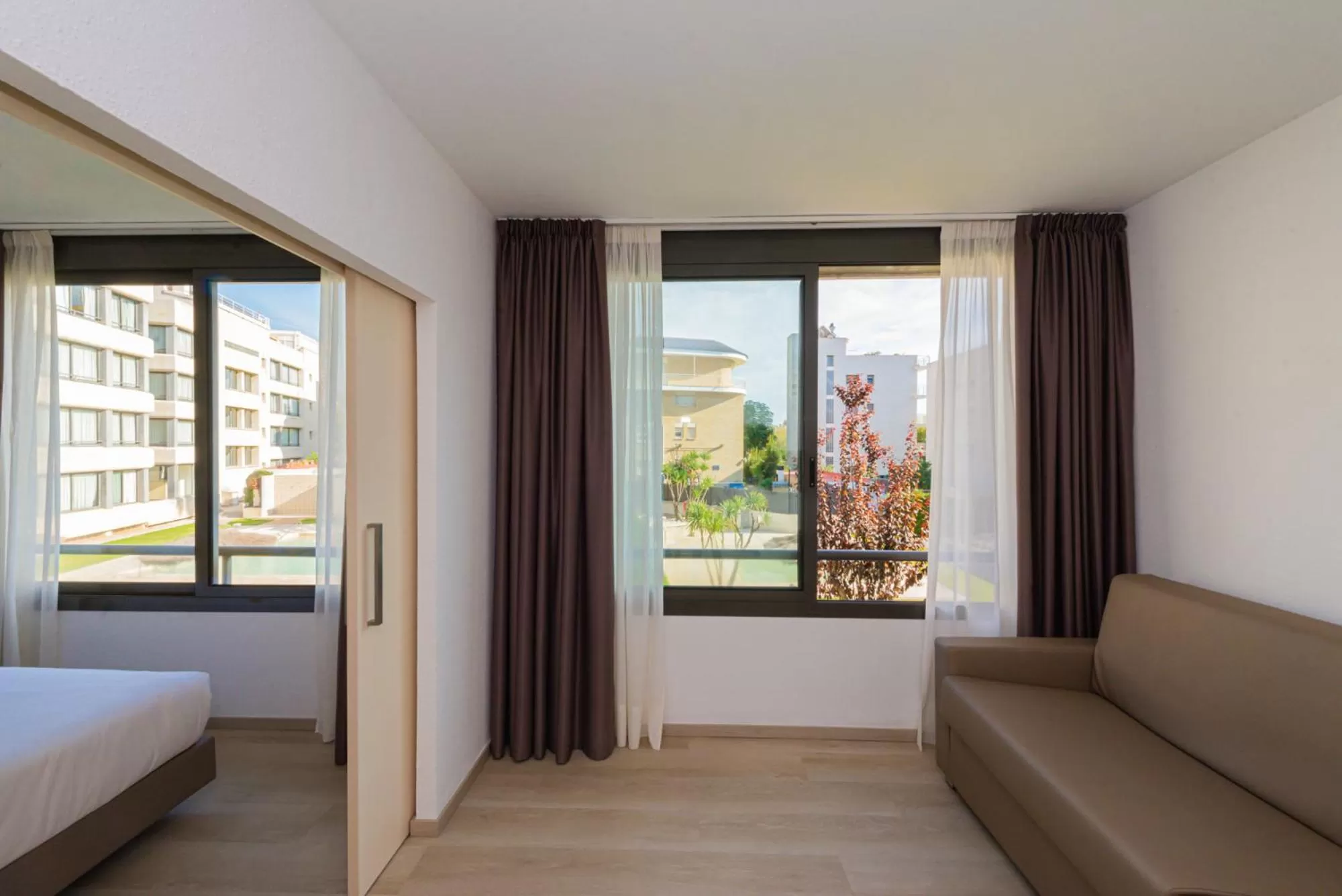 Living room, Bed in Atenea Park Suites & Apartments