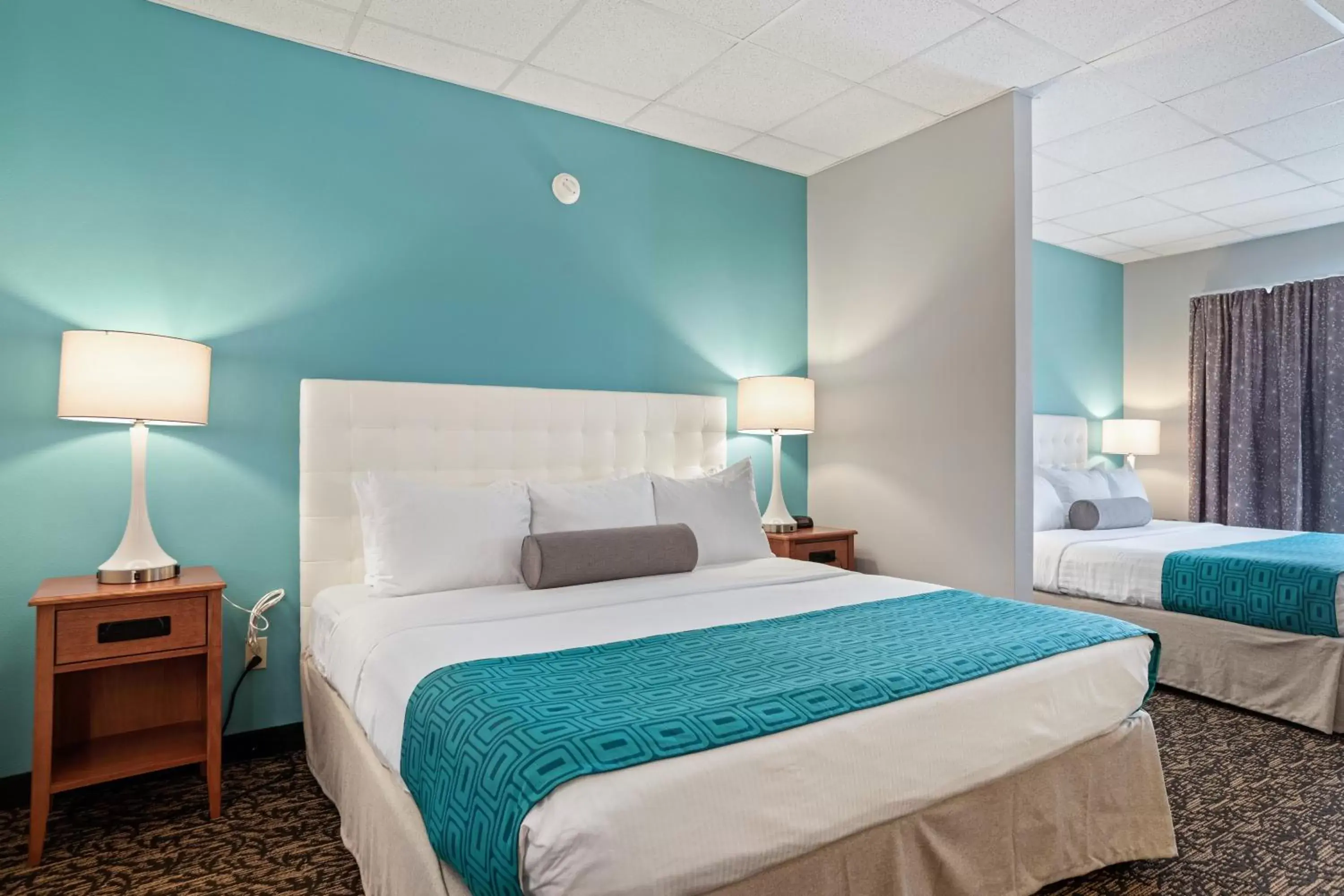 Bed in Howard Johnson by Wyndham Rapid City