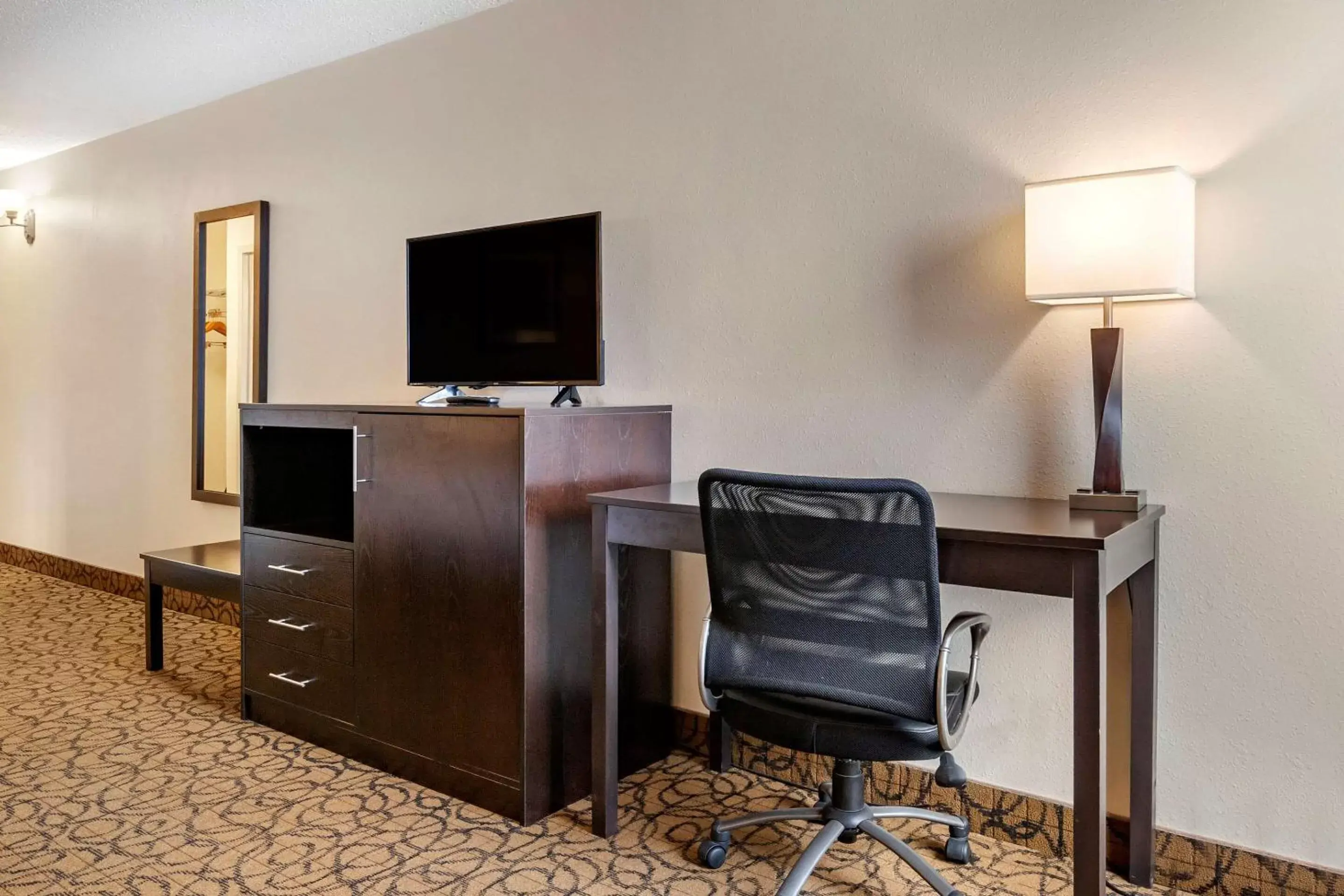 Photo of the whole room, TV/Entertainment Center in Quality Inn & Suites