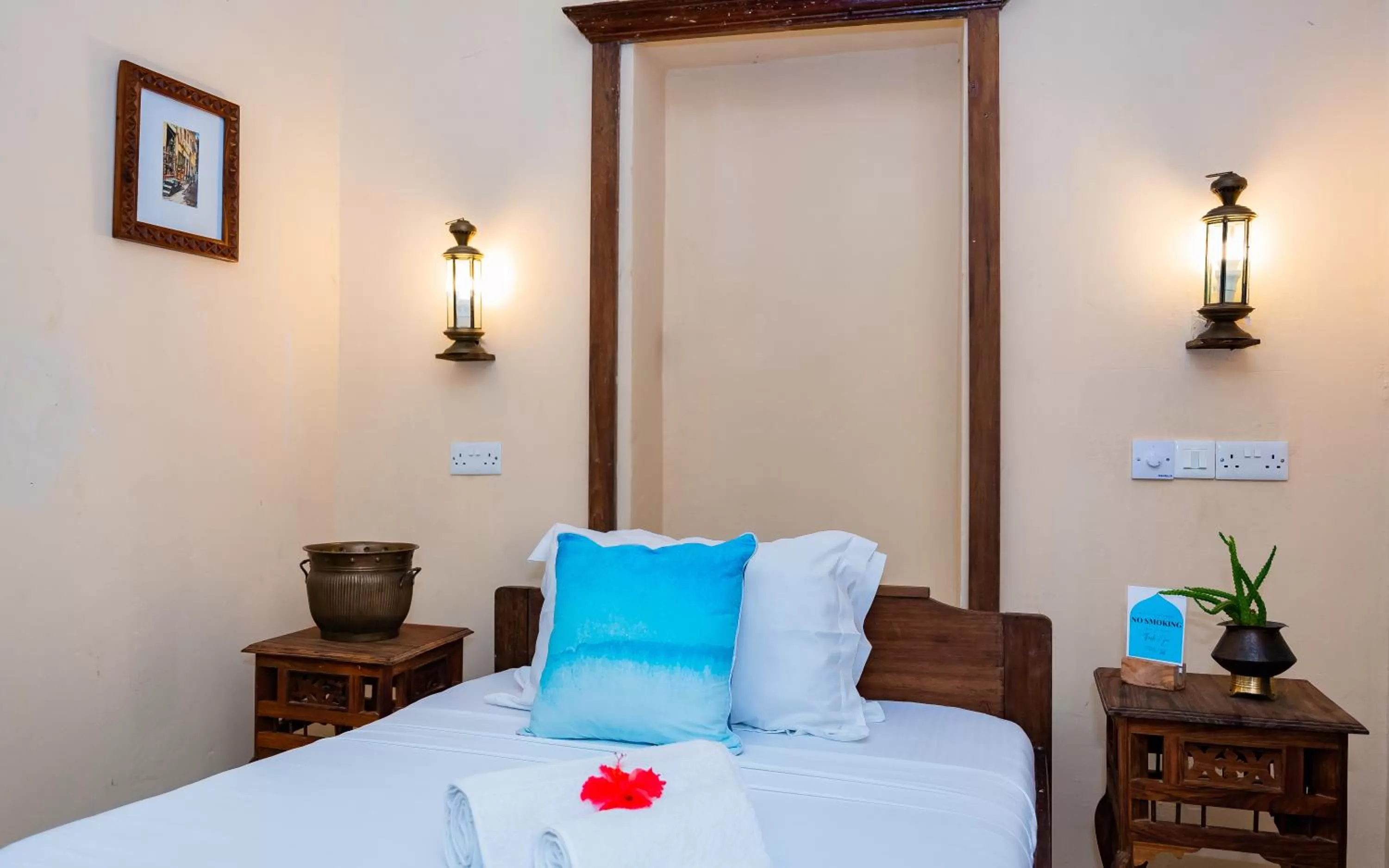 Bed in Emerald Palm Boutique Hotel