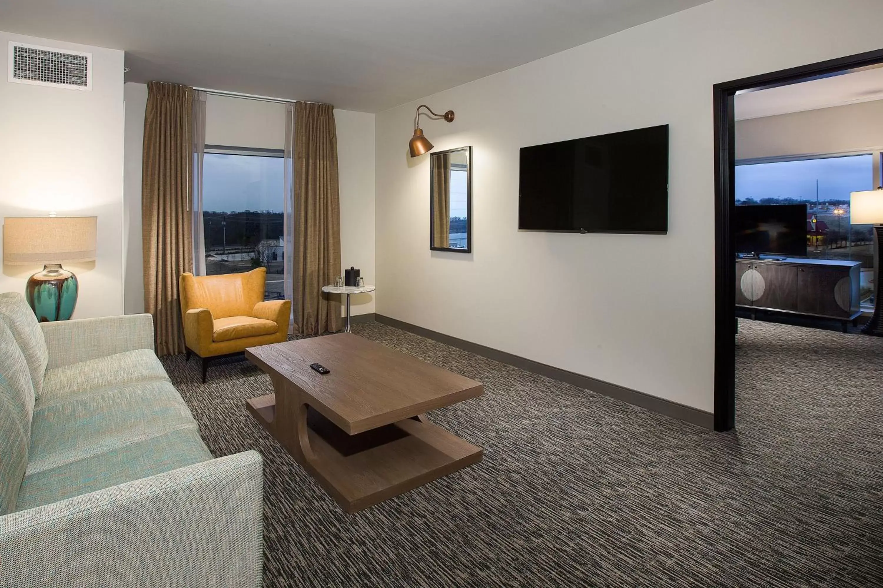 Living room, TV/Entertainment Center in Cambria Hotel Southlake DFW North