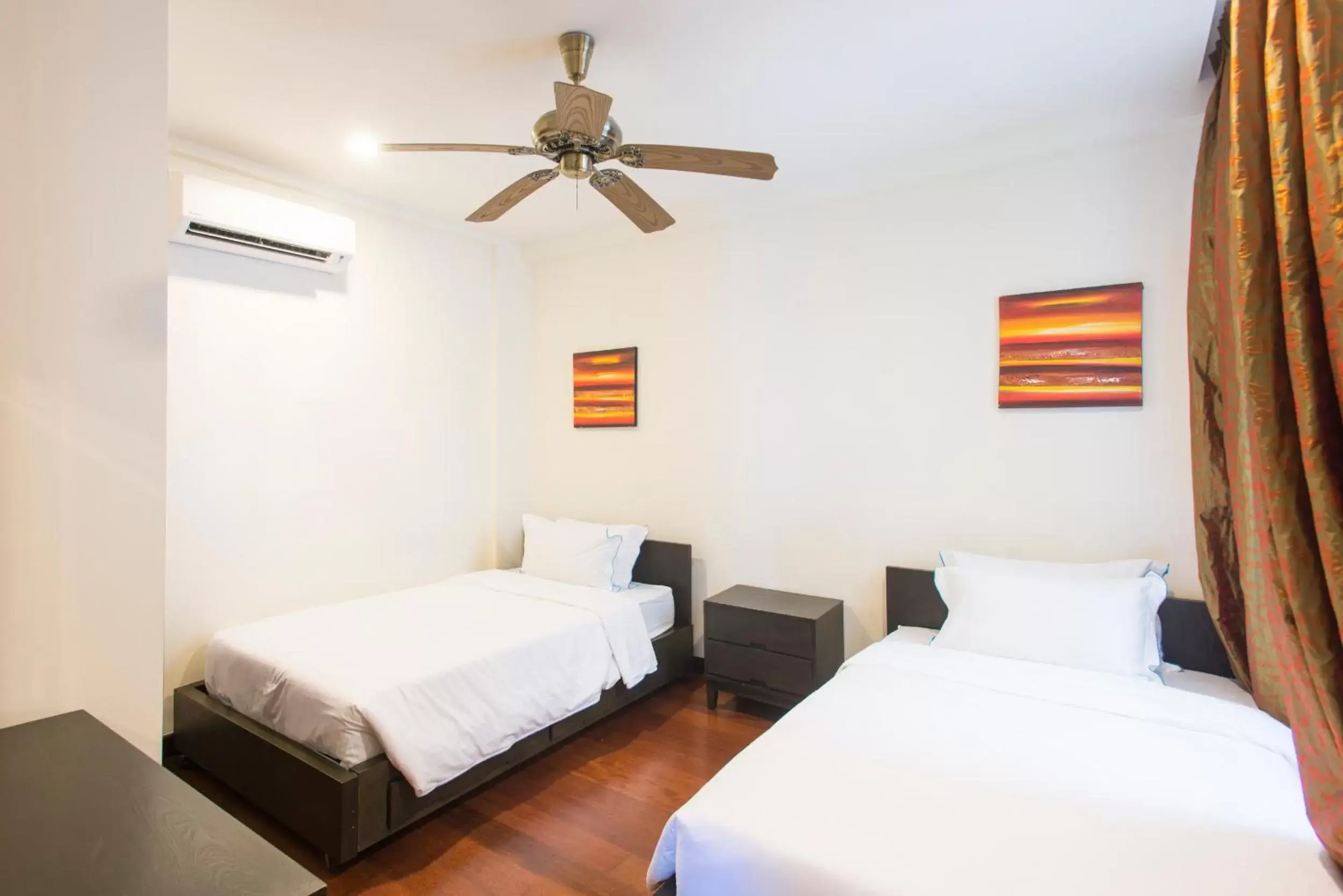 Bed in Sabah Beach Villas & Suites