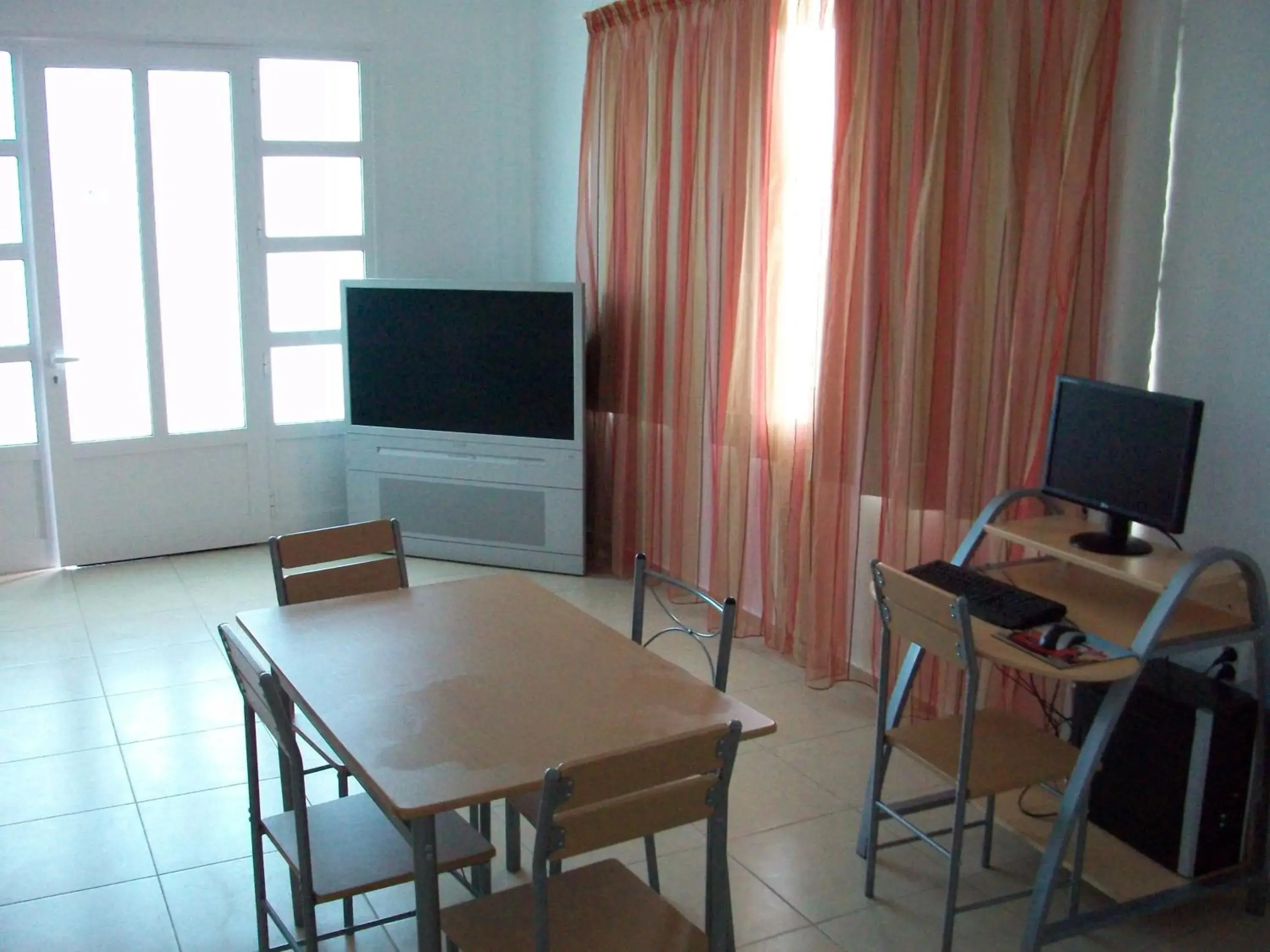 Living room, TV/Entertainment Center in Elounda Sunrise Apartments