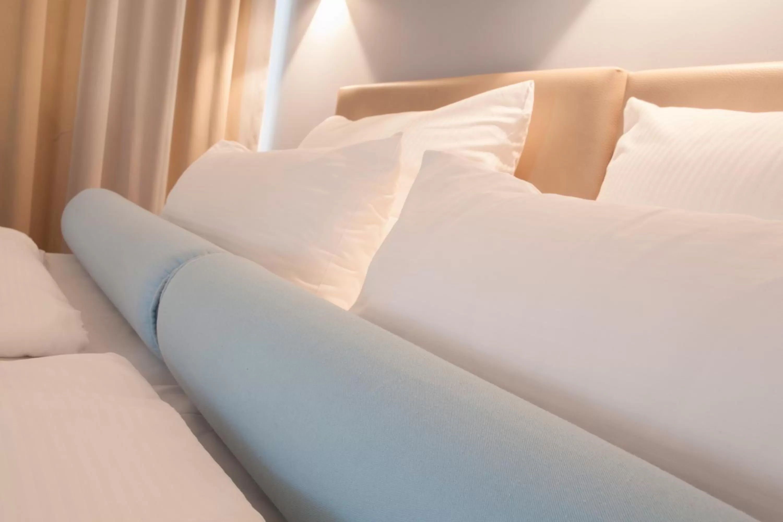 Bed in Nymphe Strandhotel & Apartments