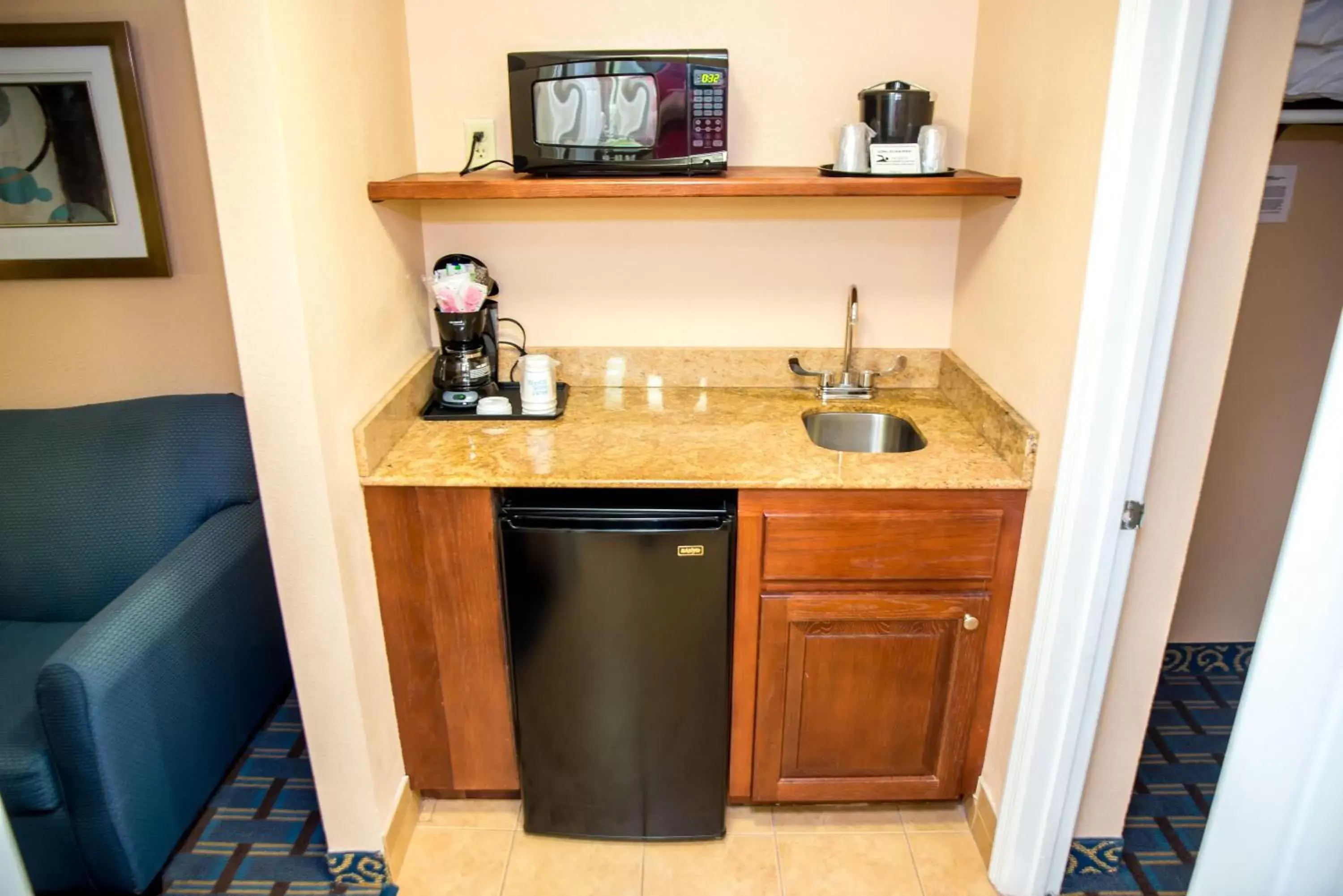 Photo of the whole room, Kitchen/Kitchenette in Holiday Inn Express Hotel & Suites Cocoa Beach, an IHG Hotel