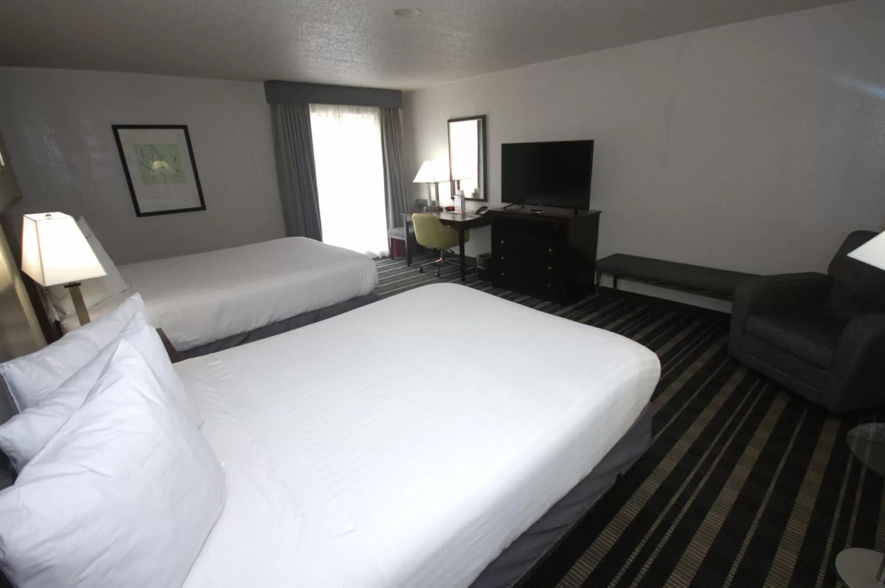 Bedroom, Bed in Atrium Hotel and Suites DFW Airport