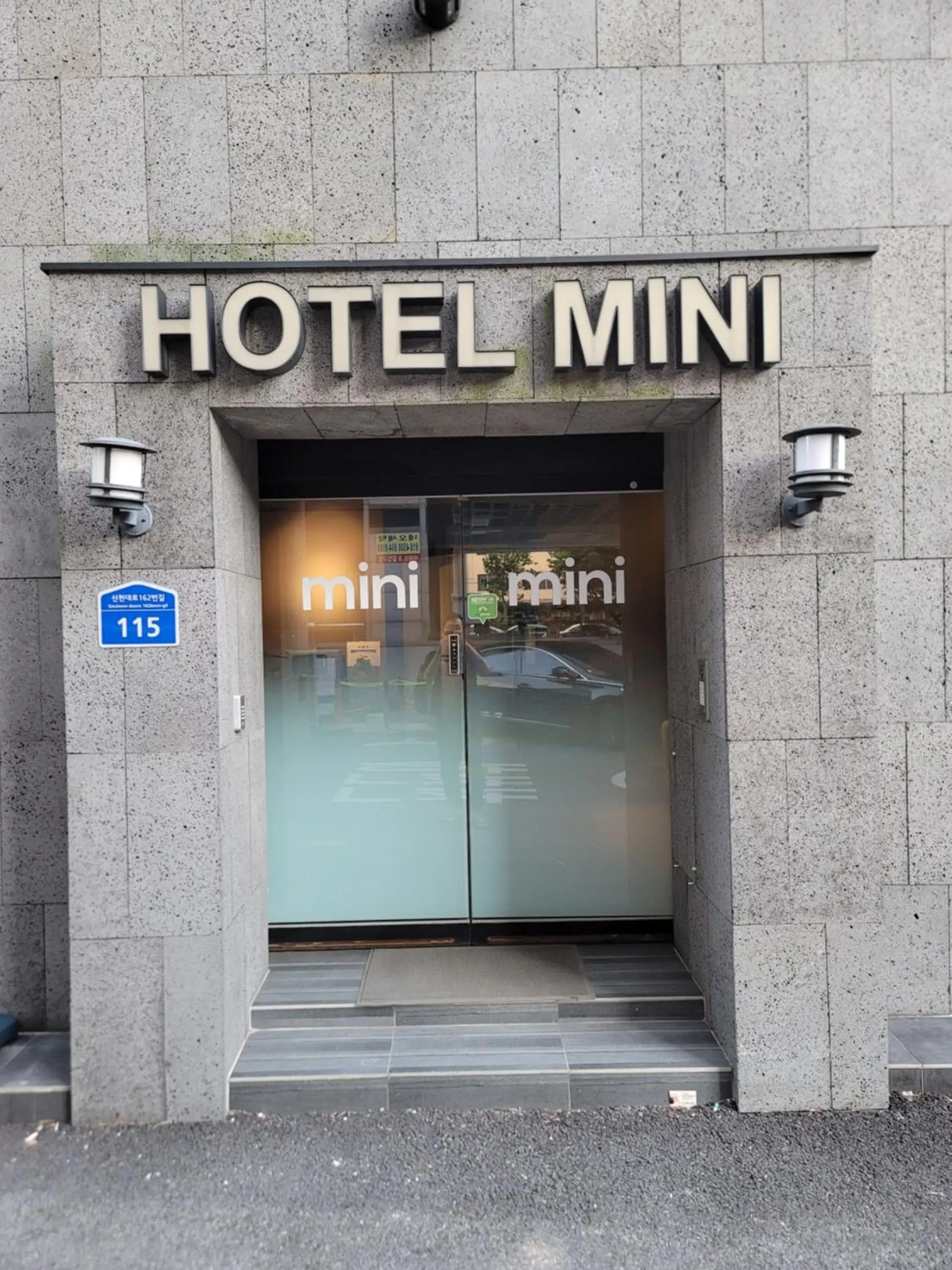 Property logo or sign in Hotel Mini