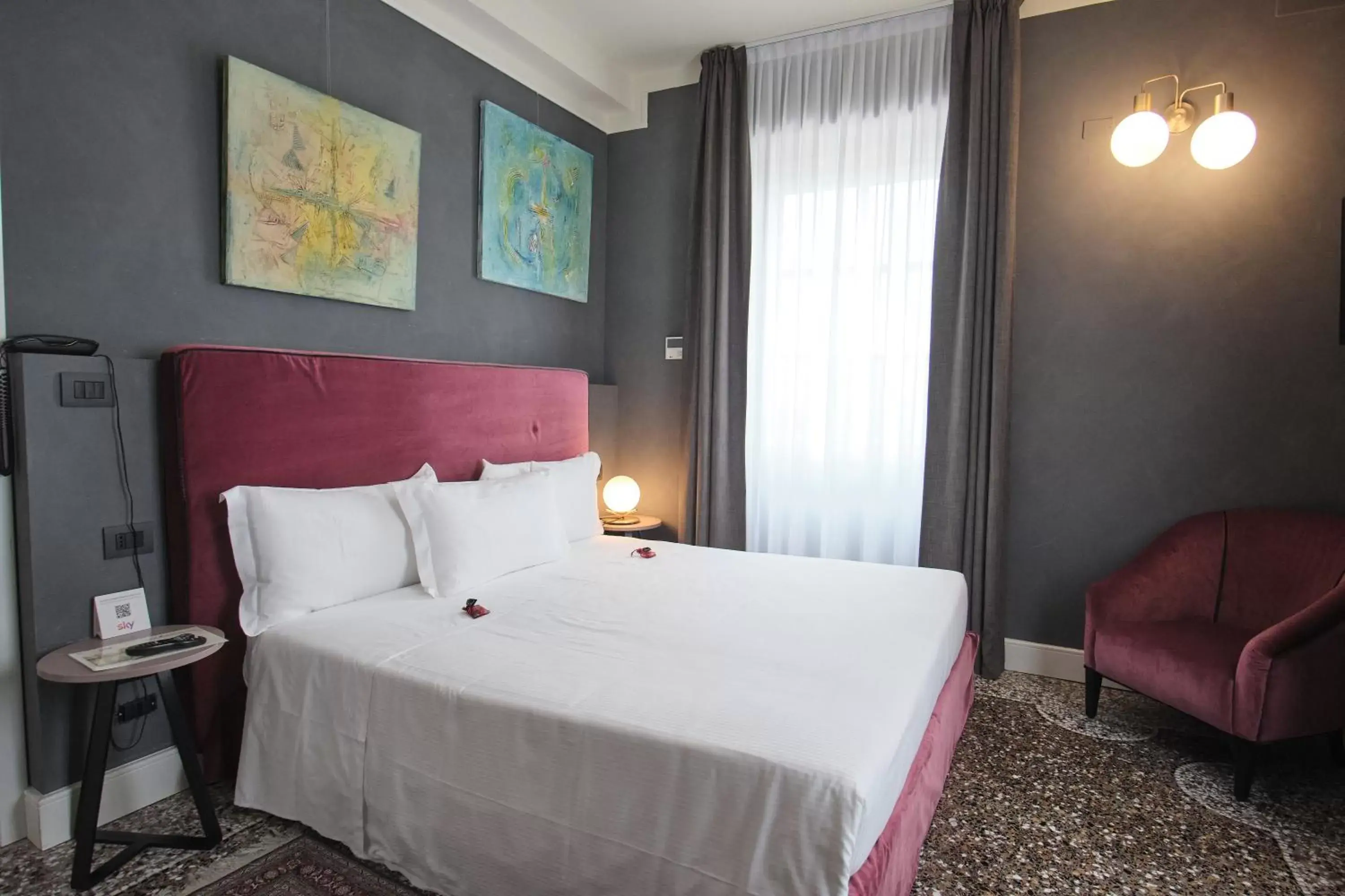 Bed in Capriccio Art Hotel