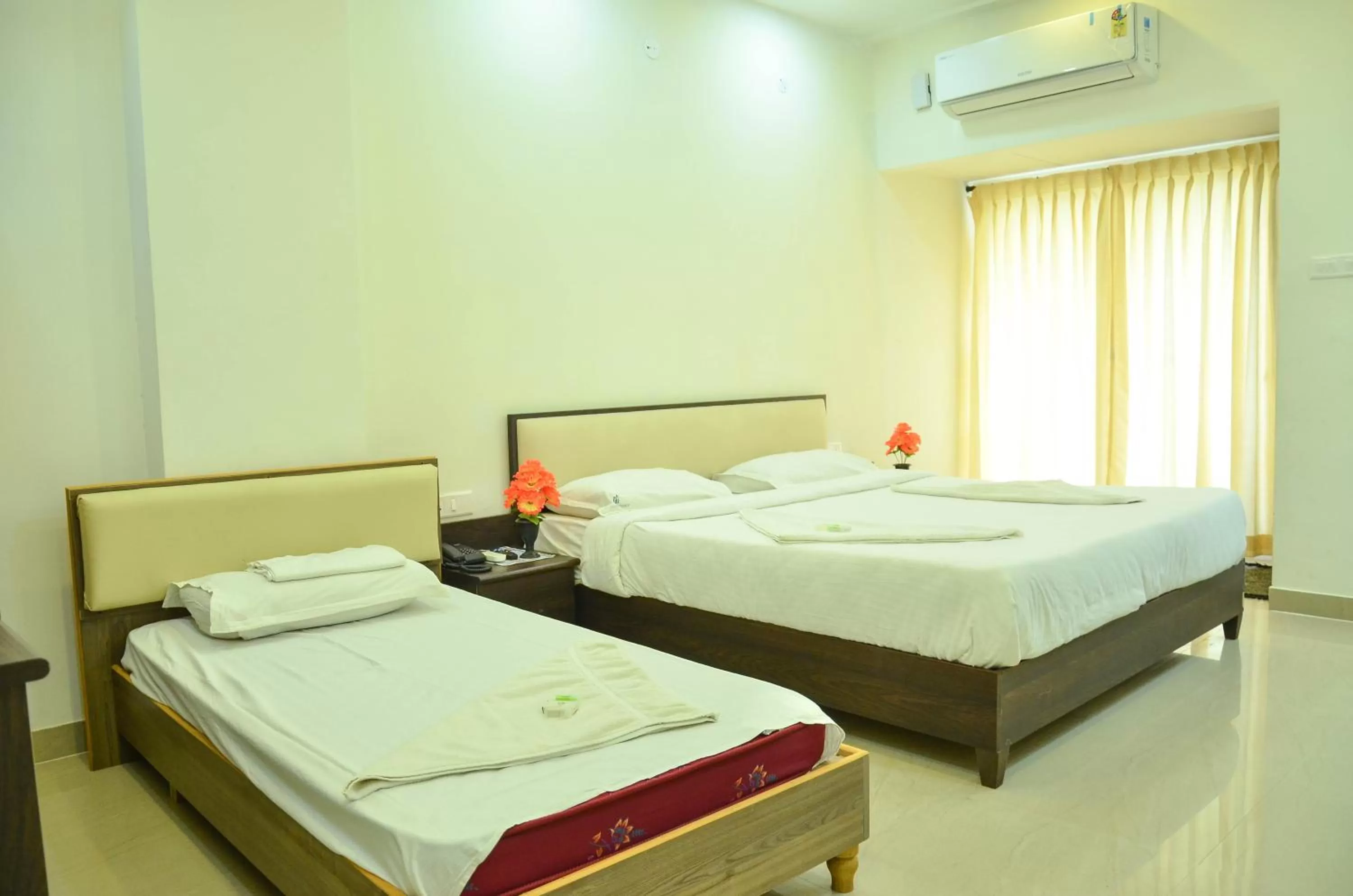 Bed in Hotel Ambai Grand