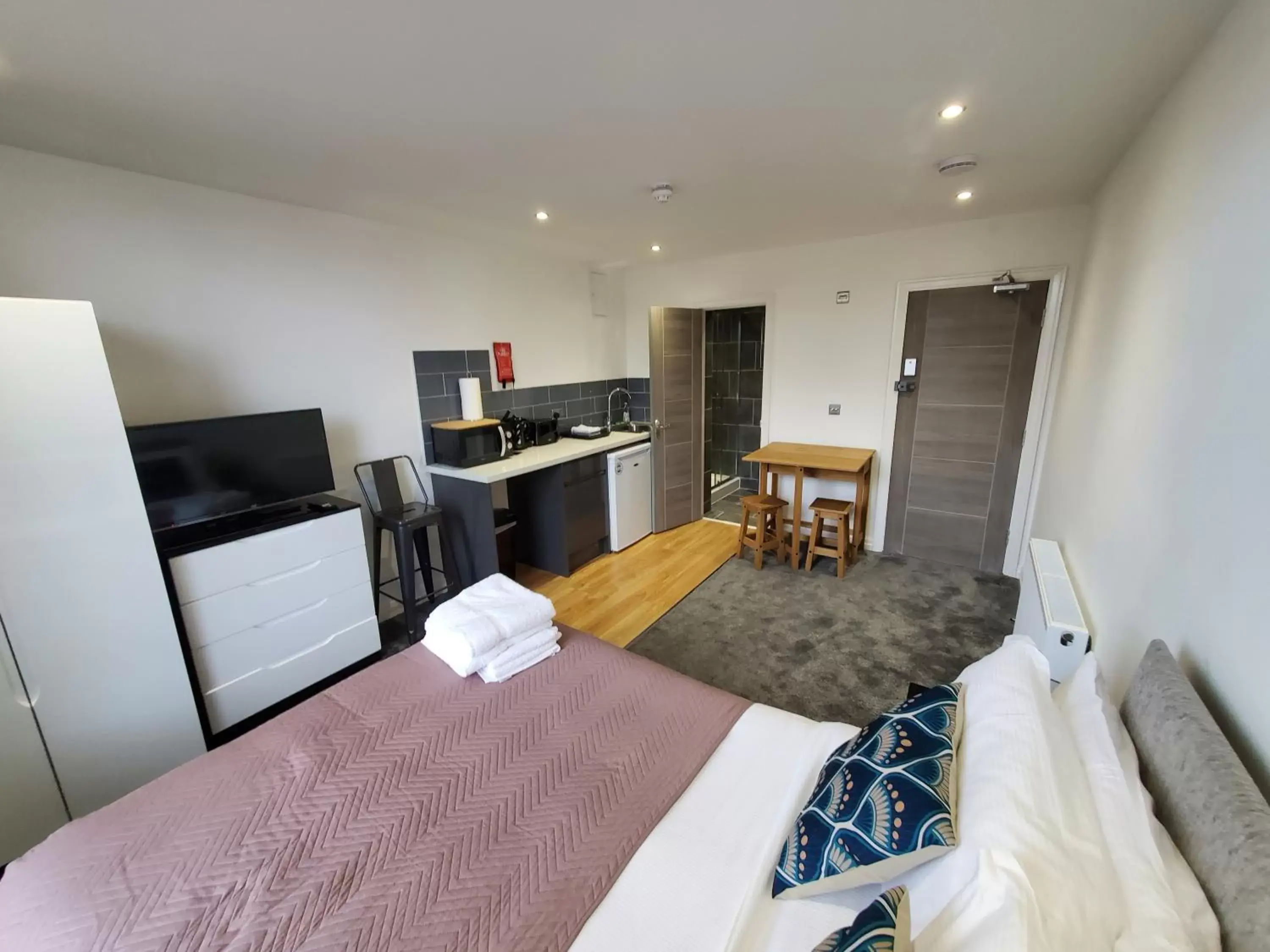 Photo of the whole room, TV/Entertainment Center in The Ashcroft Apartments