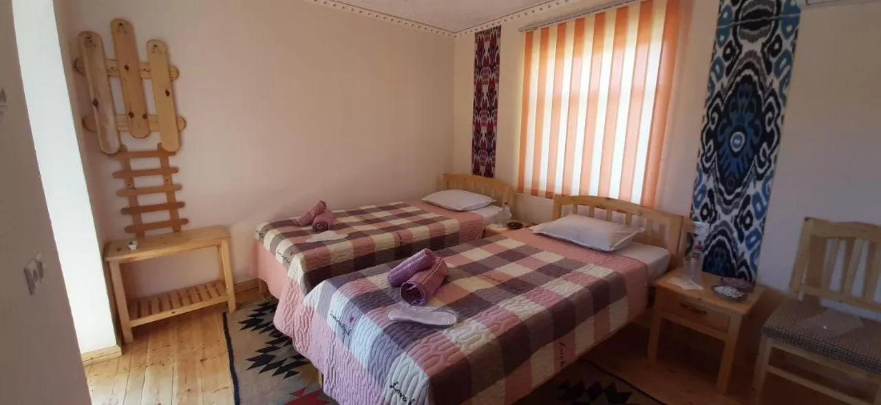 Bed in KHIVA ABDULLA Guest House