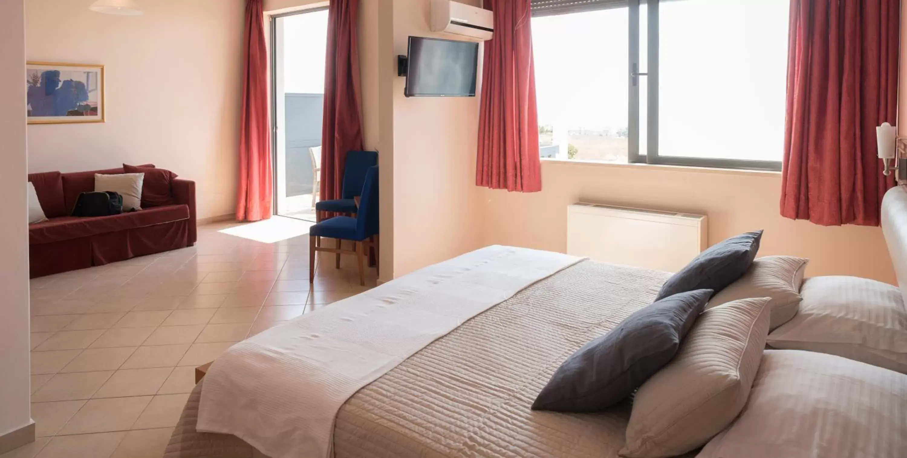 Bed in Acharnis Kavallari Hotel Suites