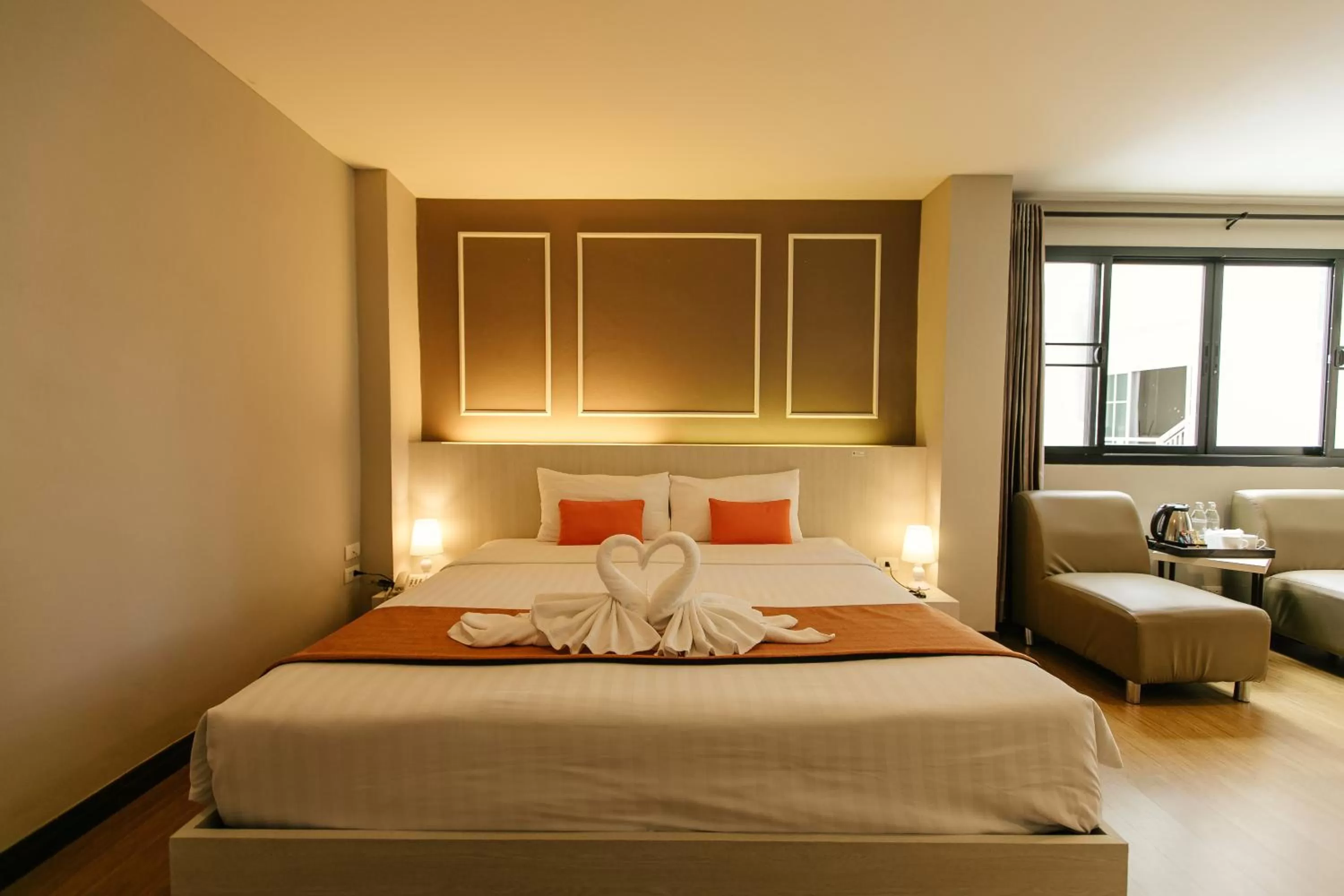 Bed in De Hug Hotel & Residence
