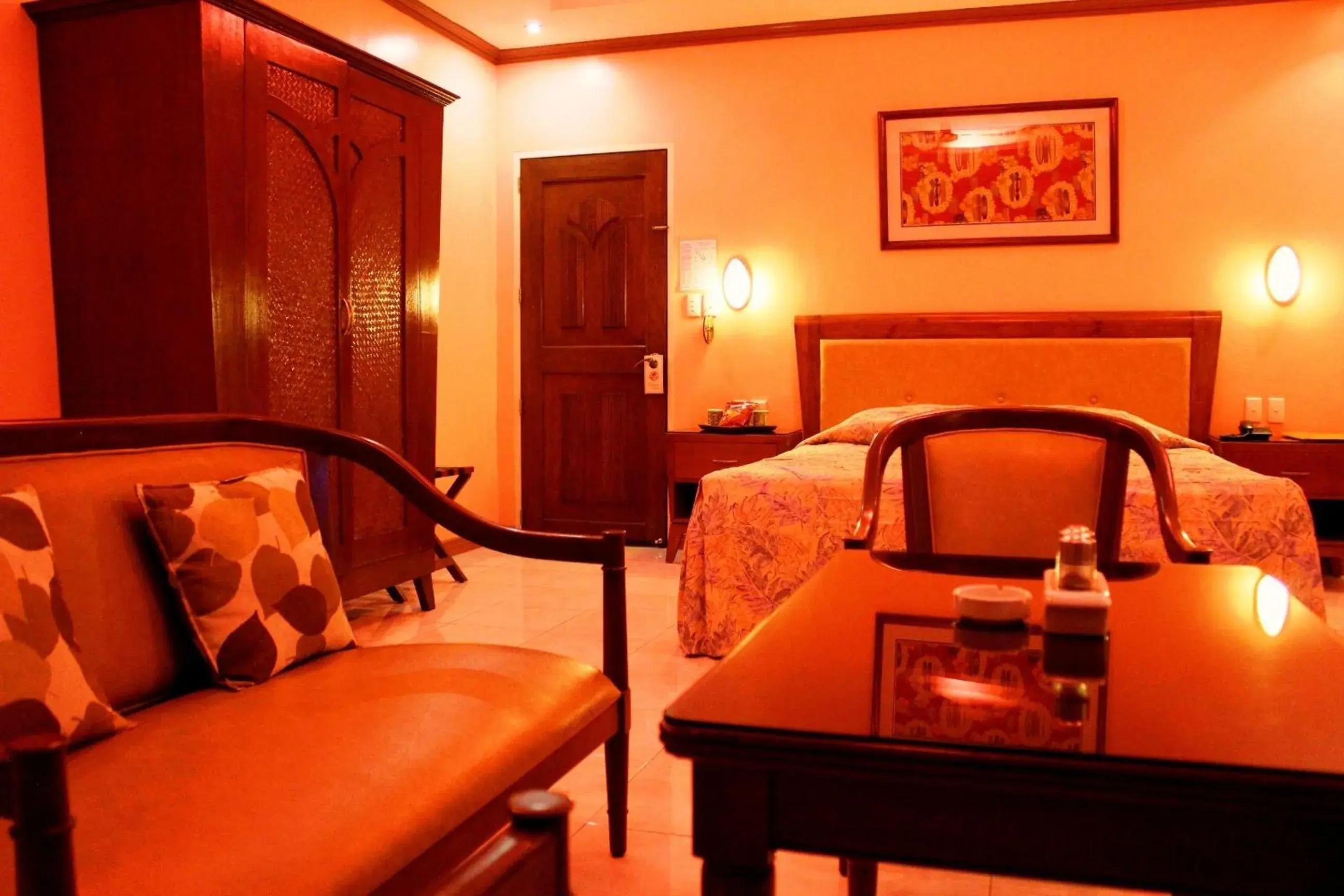 Seating area, Bed in Pacific Breeze Hotel and Resort Seating area, Bed in Pacific Breeze Hotel and Resort