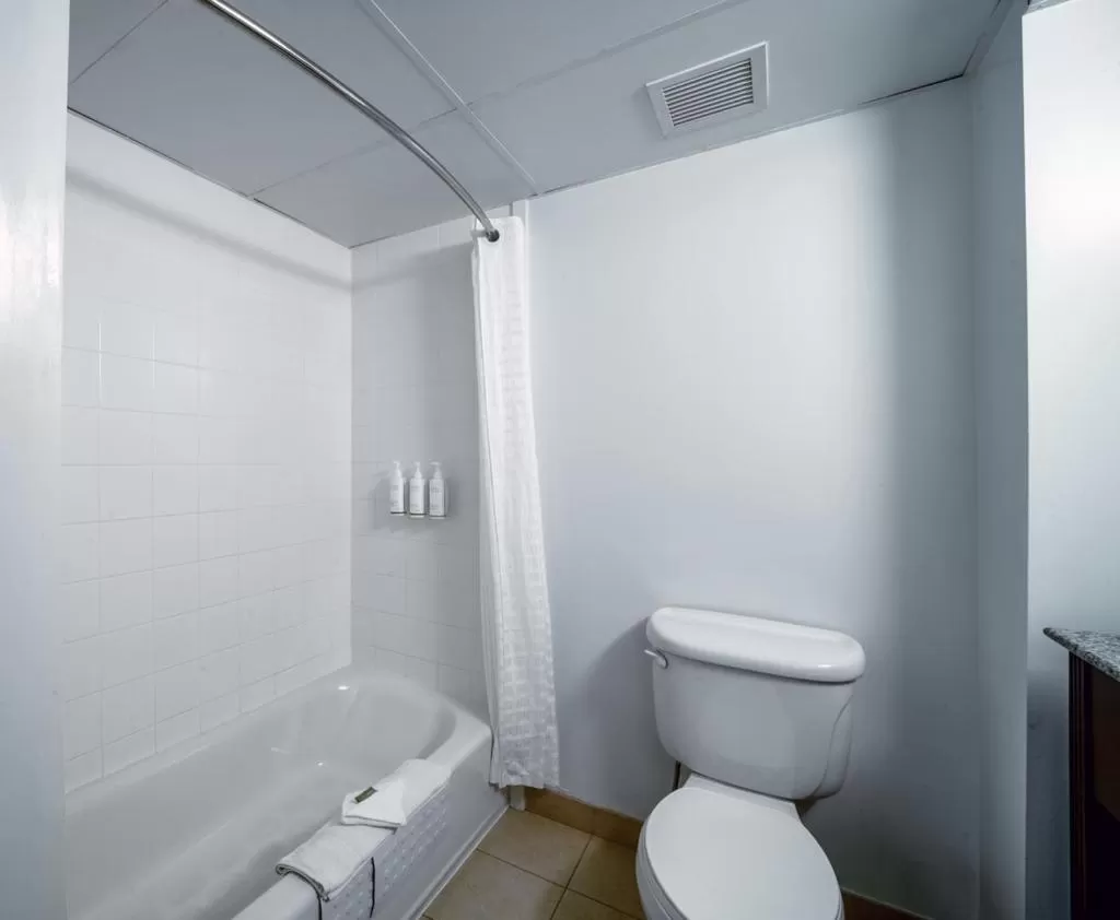 Toilet in Country Inn & Suites by Radisson, Ontario at Ontario Mills, CA