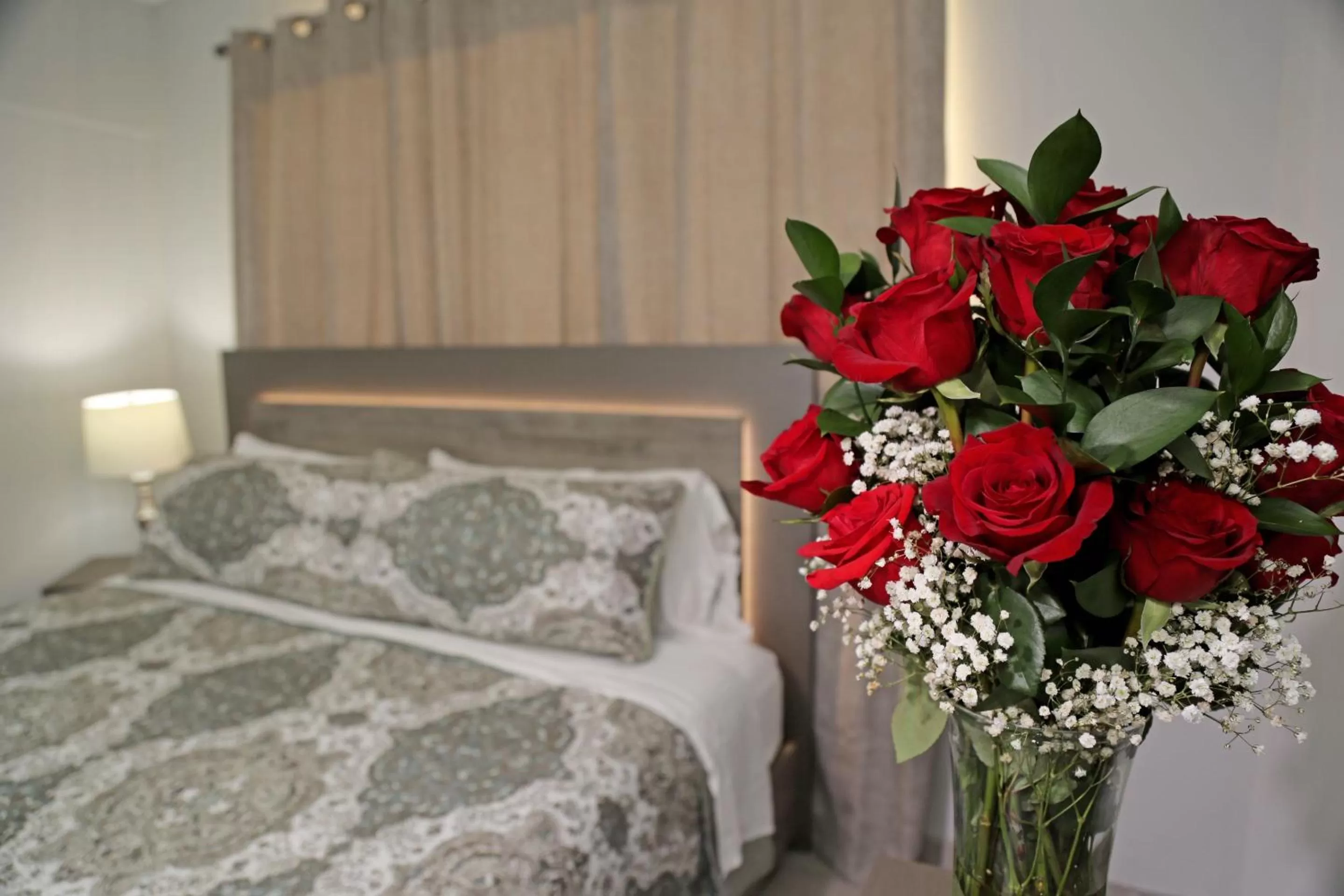 Bed in Itza-Bella Suites