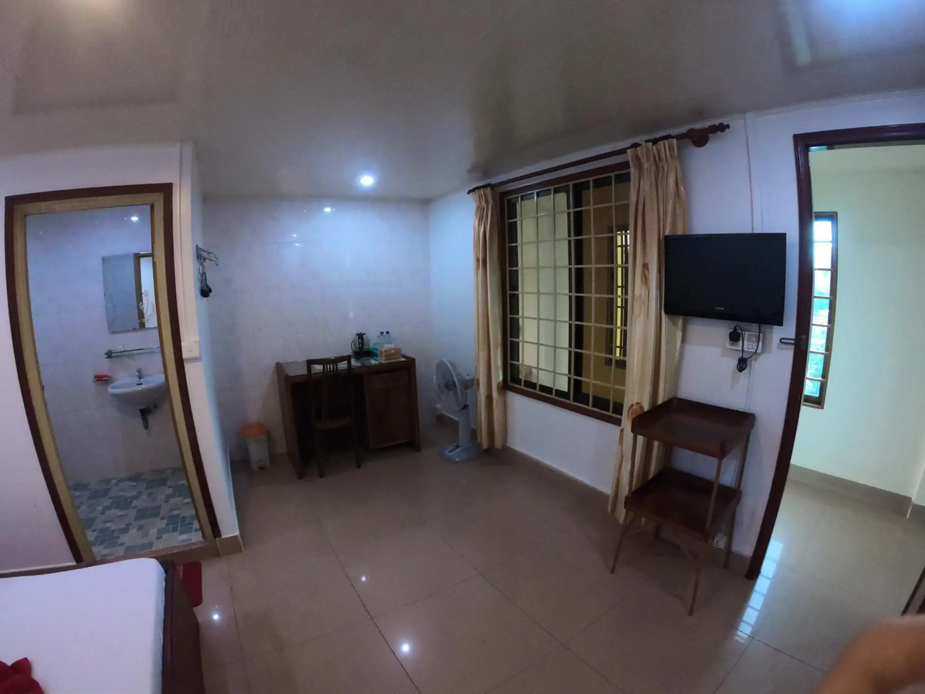 Bedroom, TV/Entertainment Center in The Bright Lotus Guesthouse