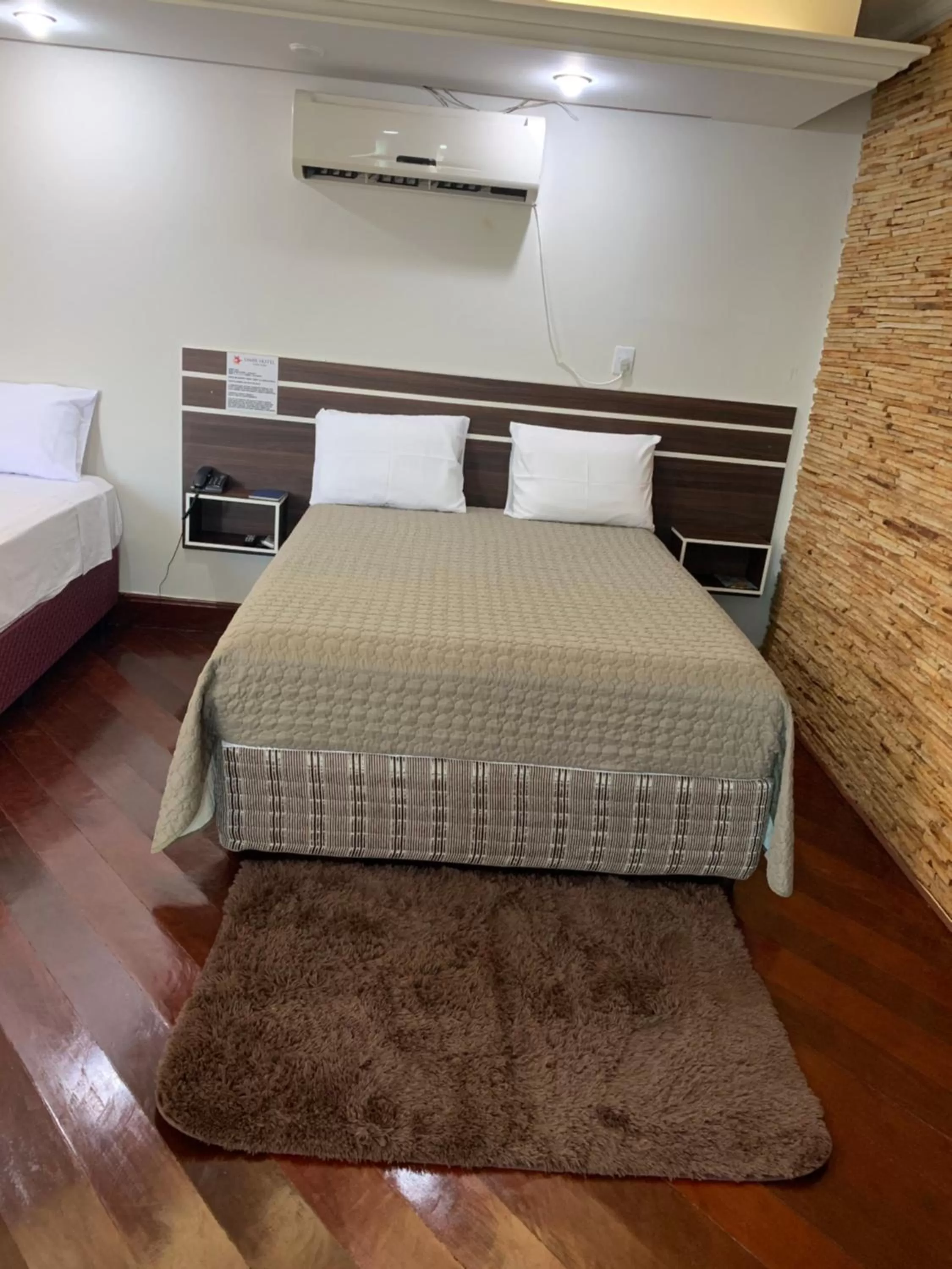 Bed in SAMIR HOTEL COMFORT