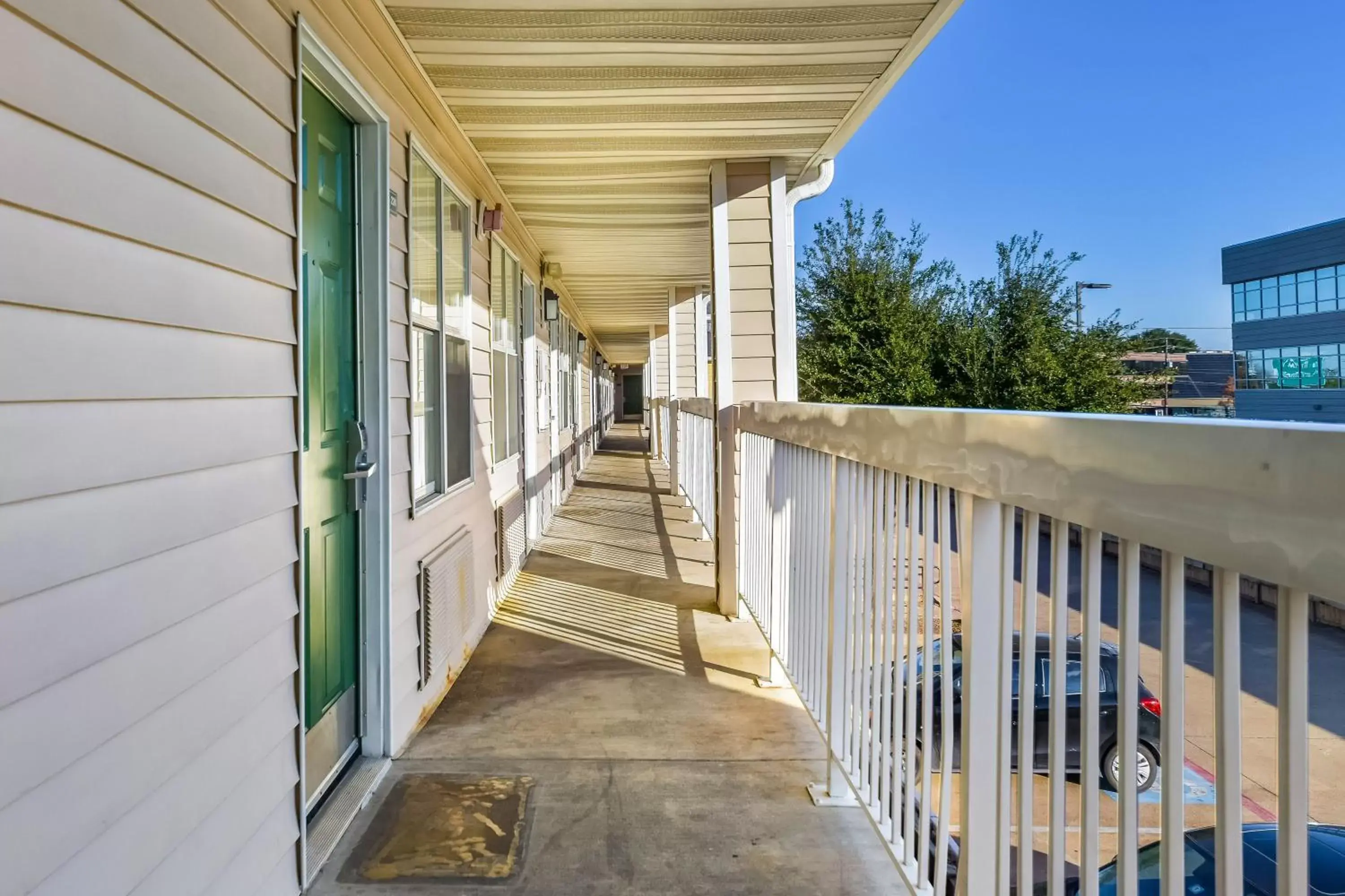 Property building, Balcony/Terrace in HomeTowne Studios by Red Roof Dallas - North Addison - Tollway