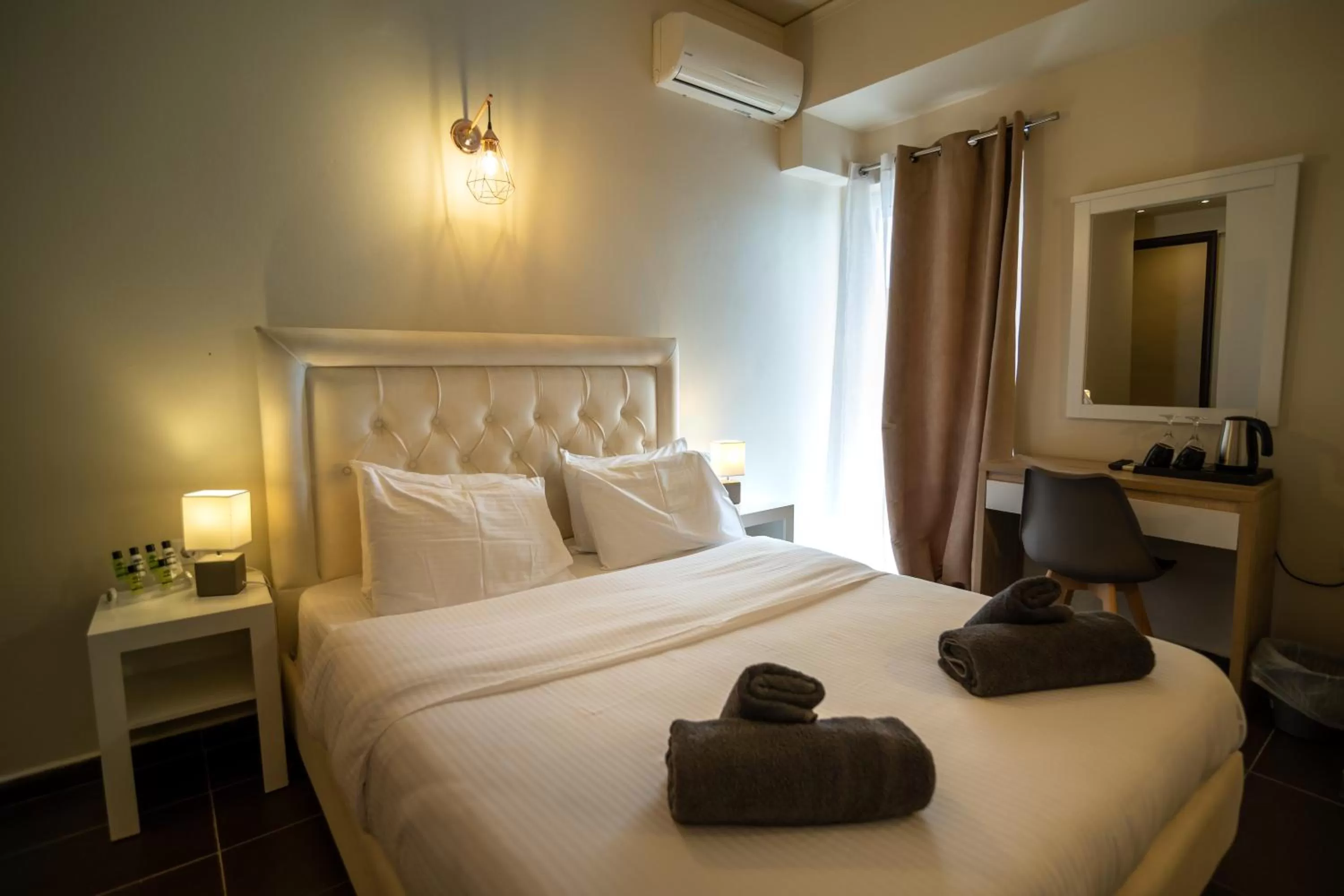 Bed in Votsalakia Hotel & Luxury Apartments