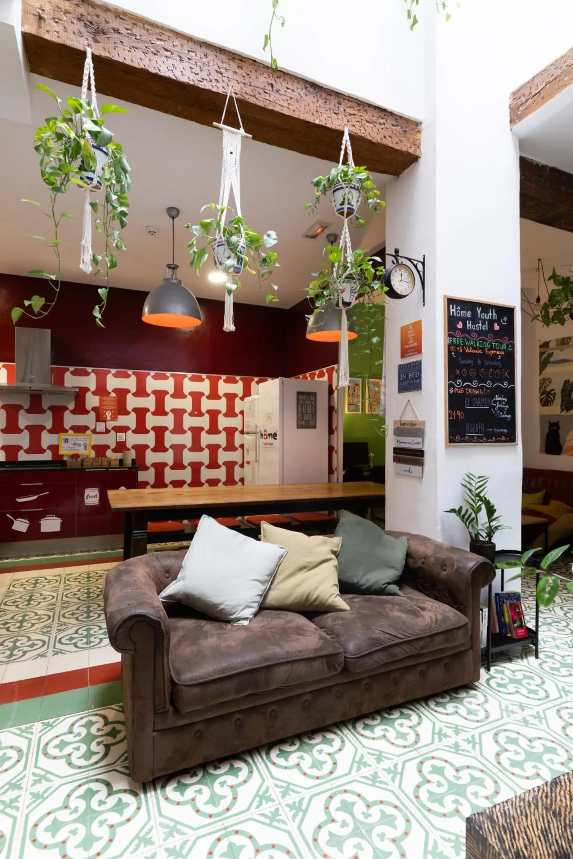 Communal lounge/ TV room, Seating Area in Home Youth Hostel by Feetup Hostels
