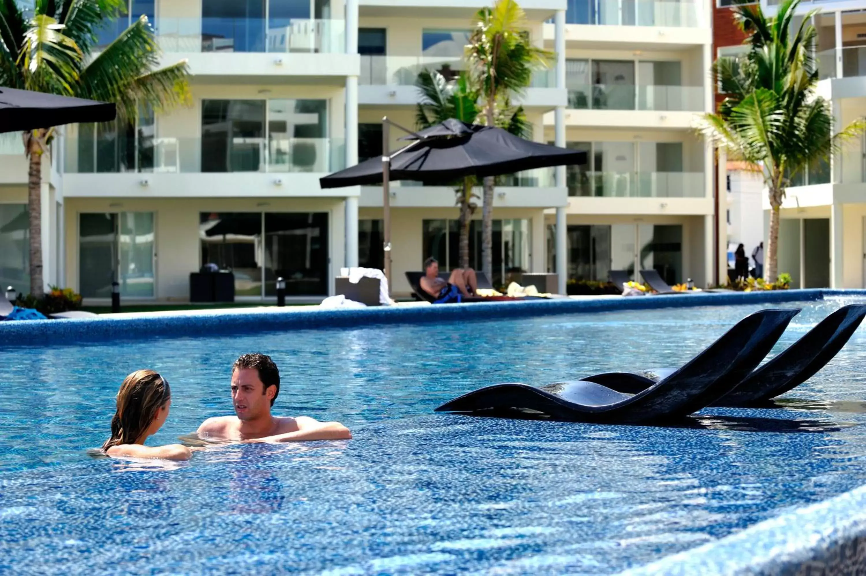 Facade/entrance, Swimming Pool in The Elements Oceanfront & Beachside Condo Hotel