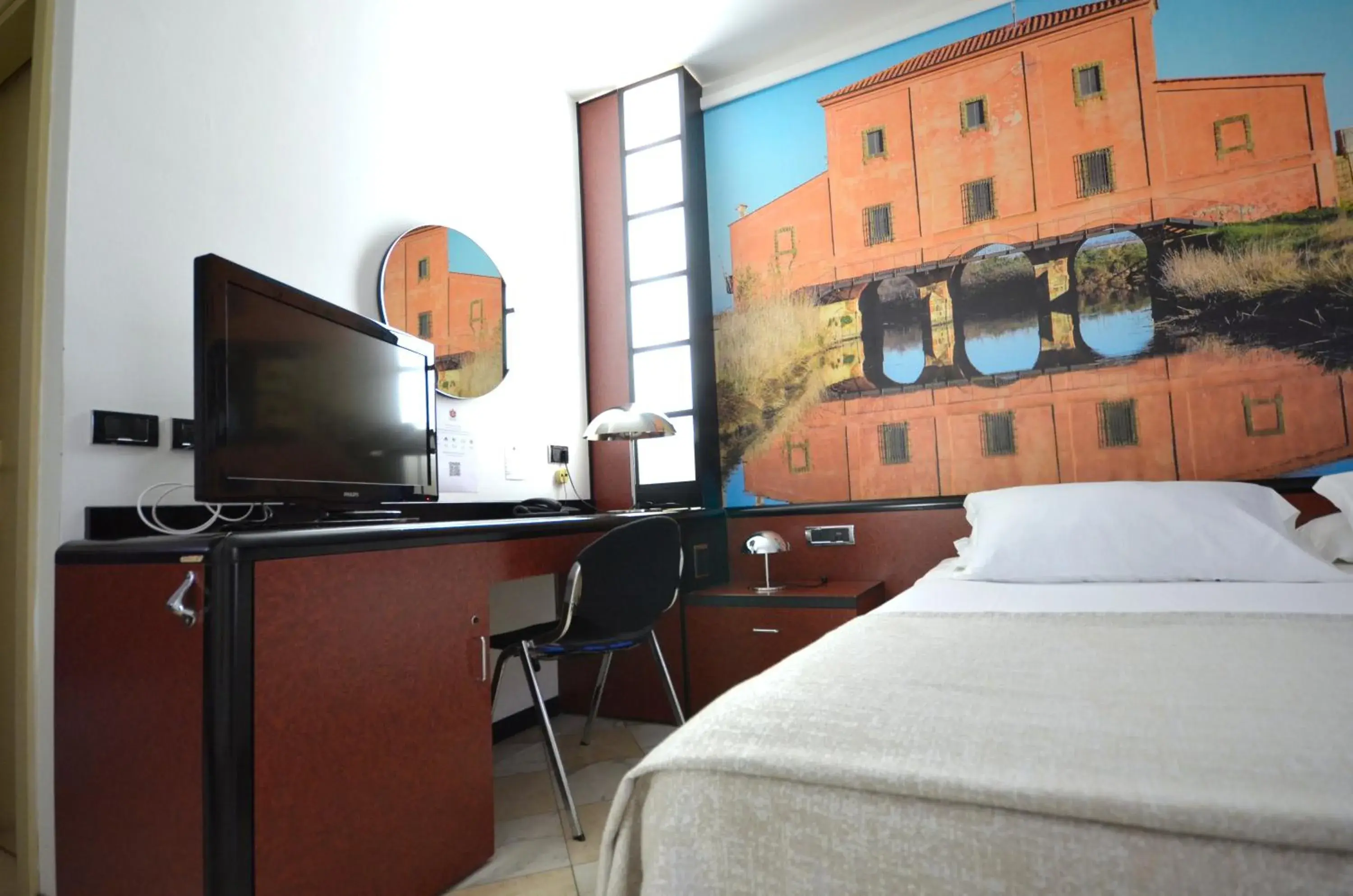 Bed, TV/Entertainment Center in Hotel Granduca