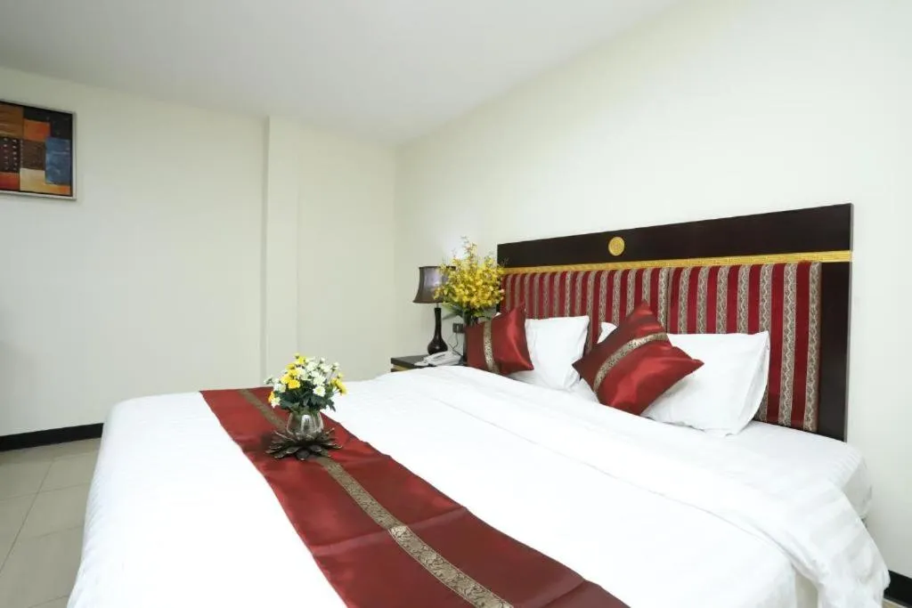 Bed in Lucky Palace Hotel