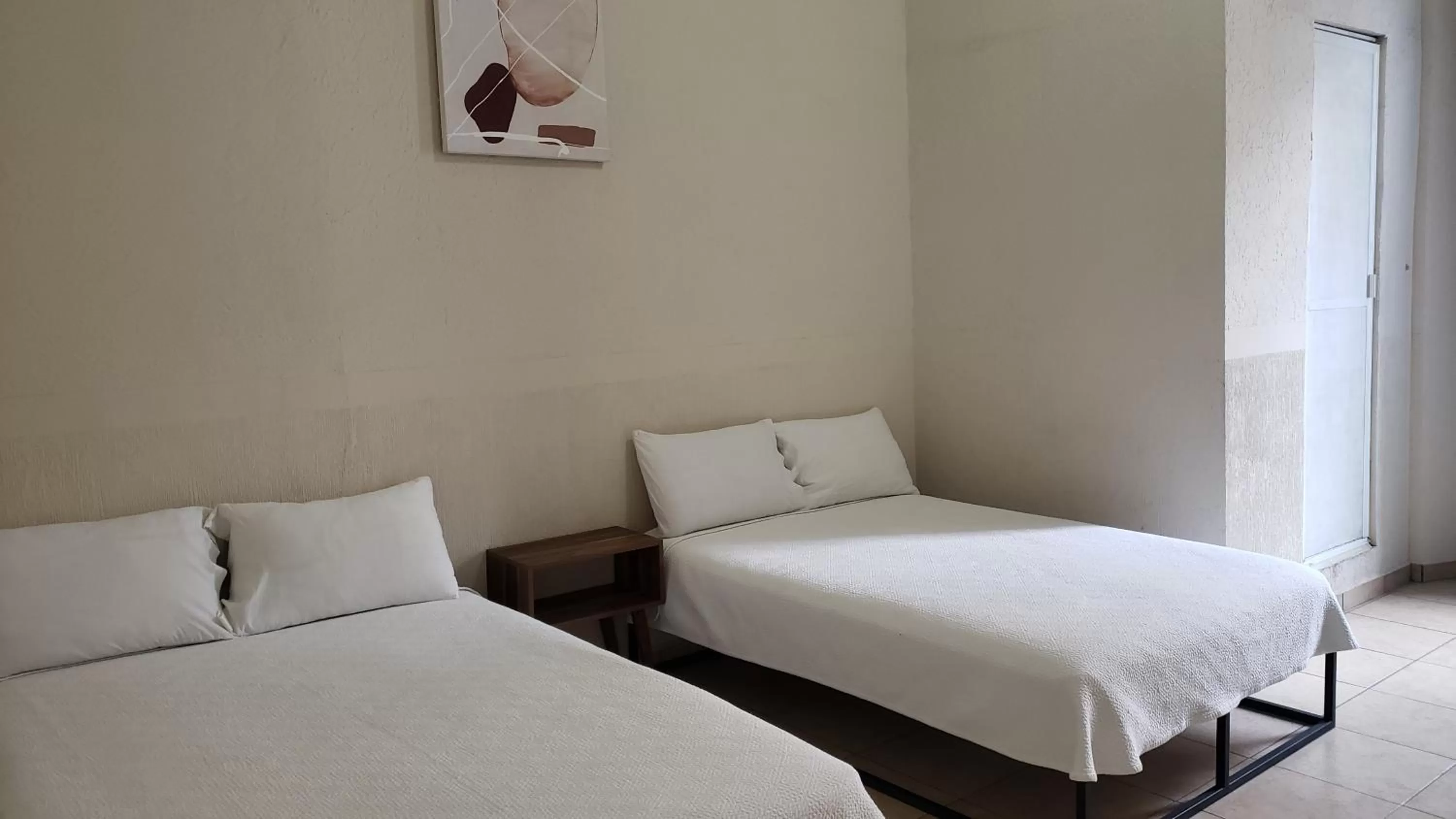 Bed in Hotel Grand Isitia