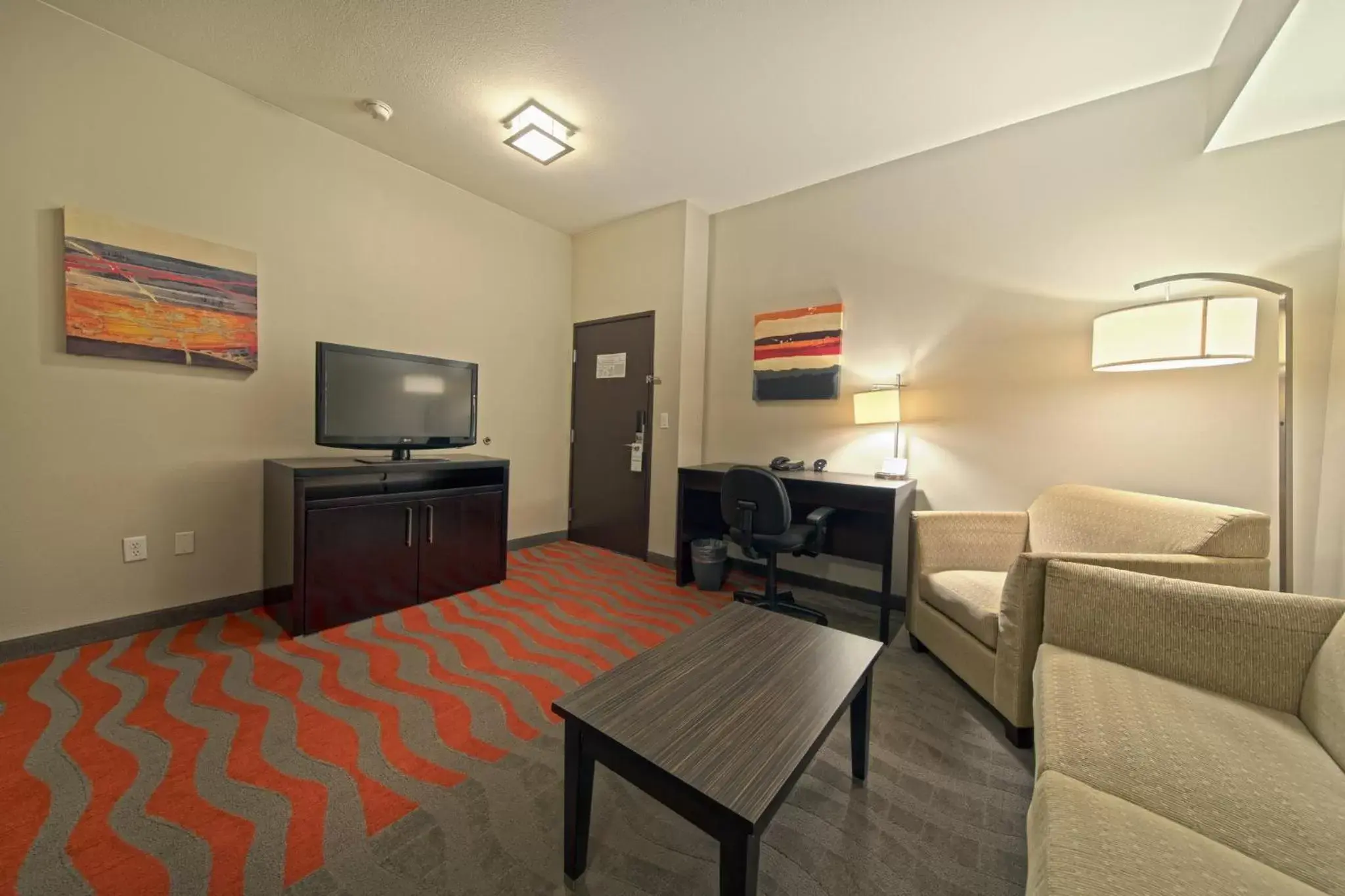 Photo of the whole room, TV/Entertainment Center in Holiday Inn Houston West - Westway Park, an IHG Hotel