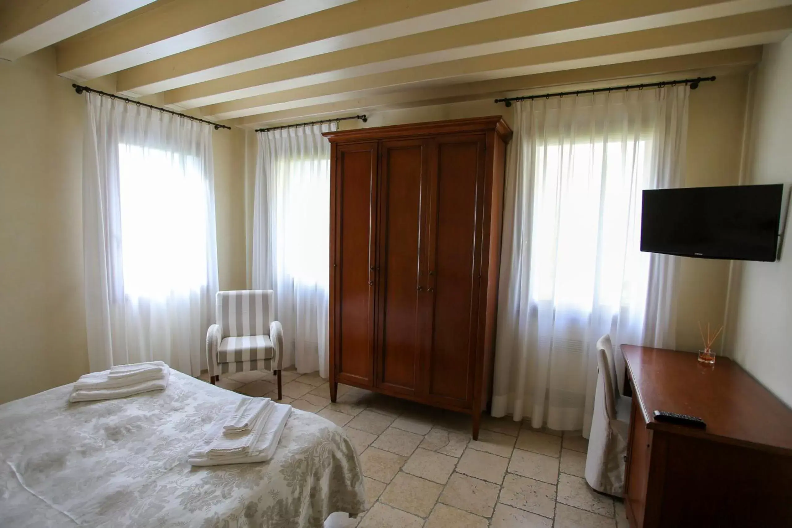 Bed, TV/Entertainment Center in Relais Villa Selvatico
