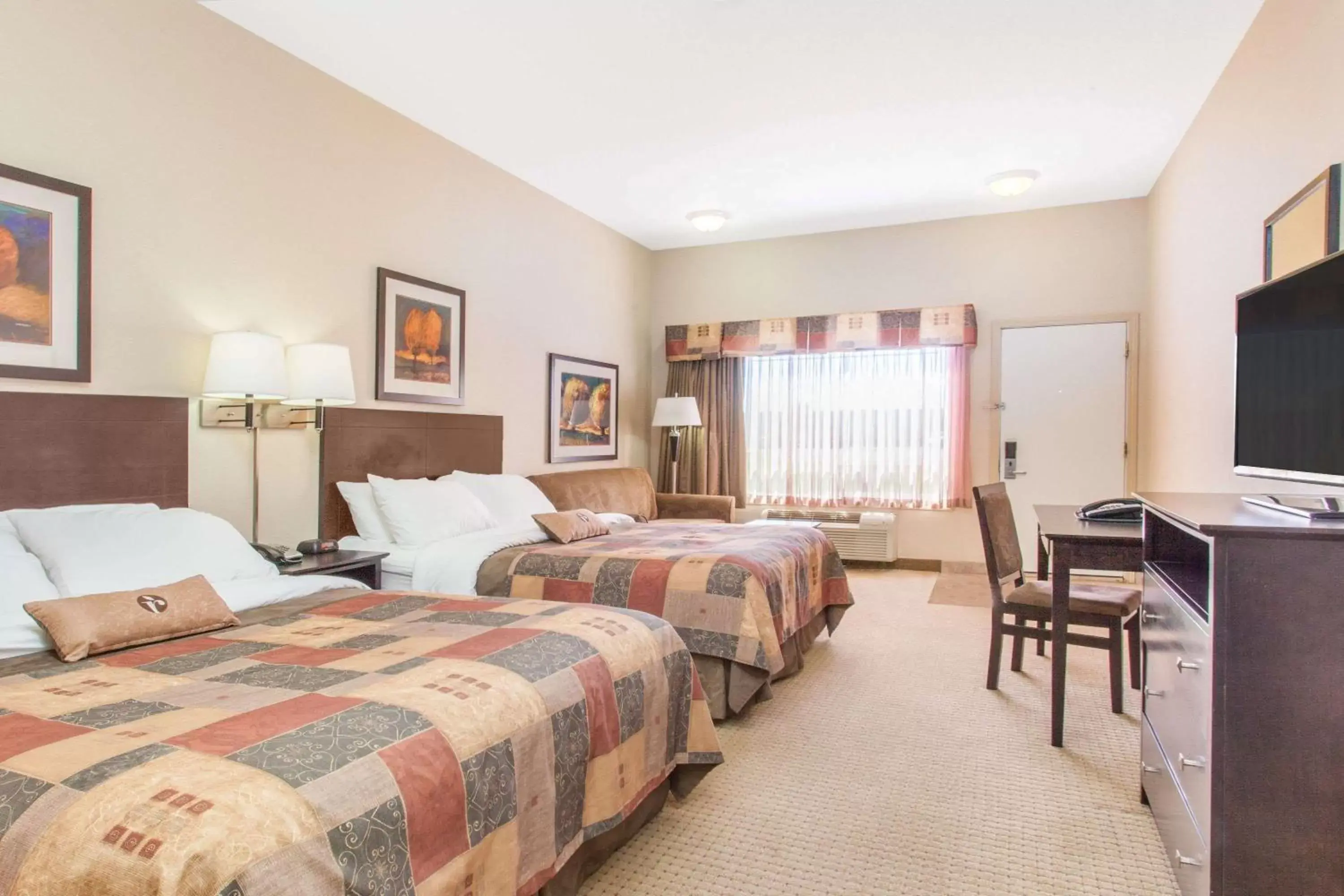 Photo of the whole room, Bed in Ramada by Wyndham Pincher Creek