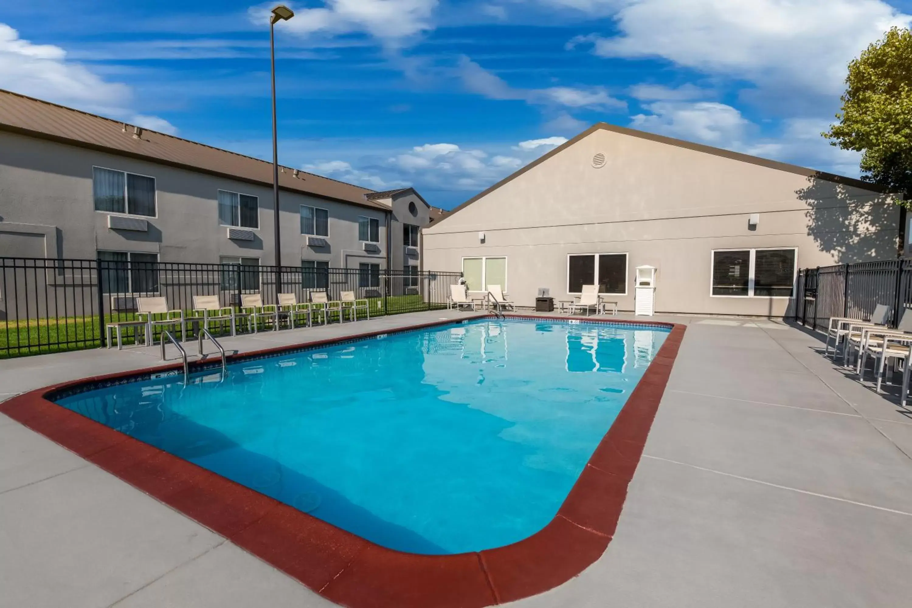 Swimming pool, Property Building in Country Inn & Suites by Radisson, Wichita East, KS