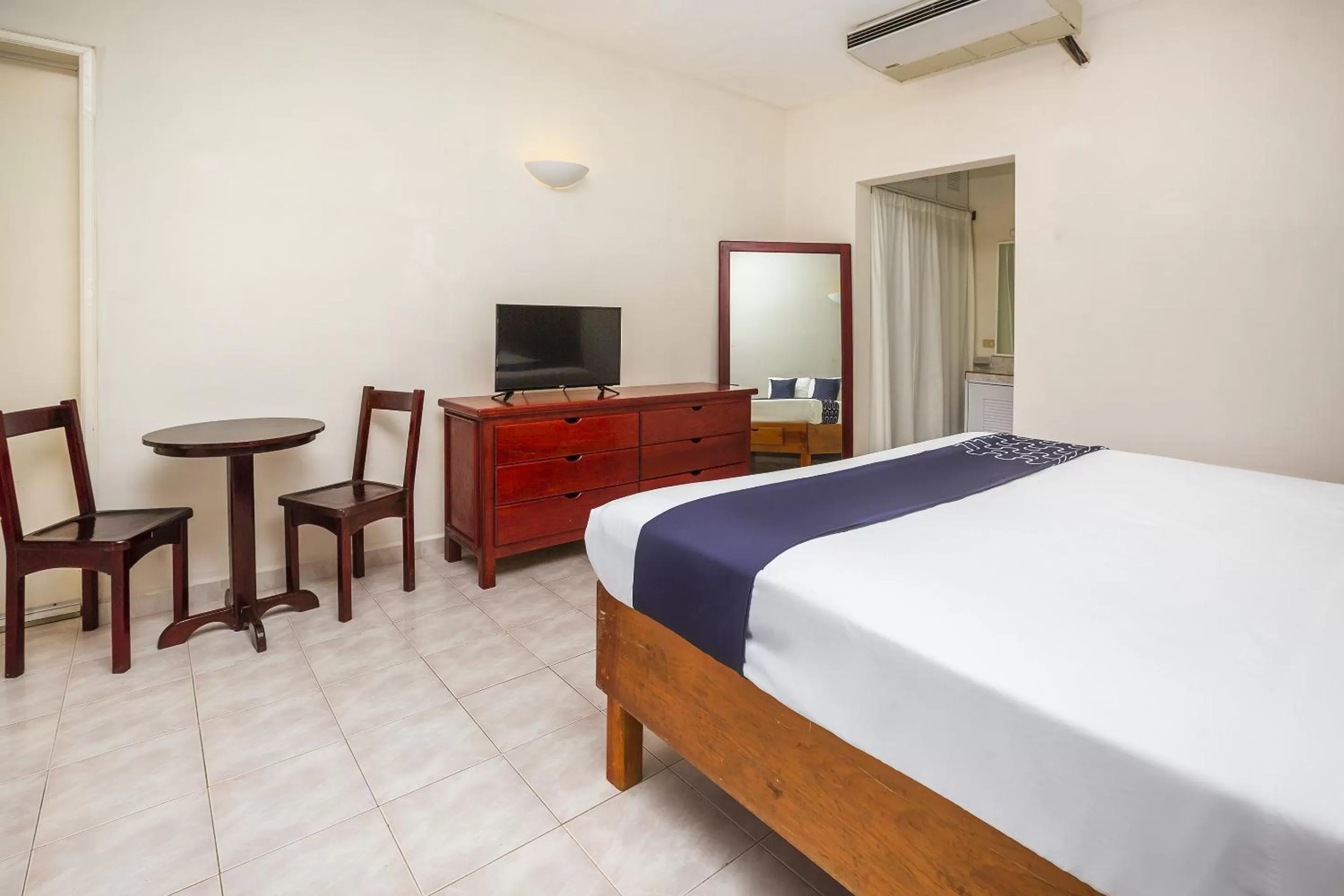 Bed in Hotel Kiin Cozumel