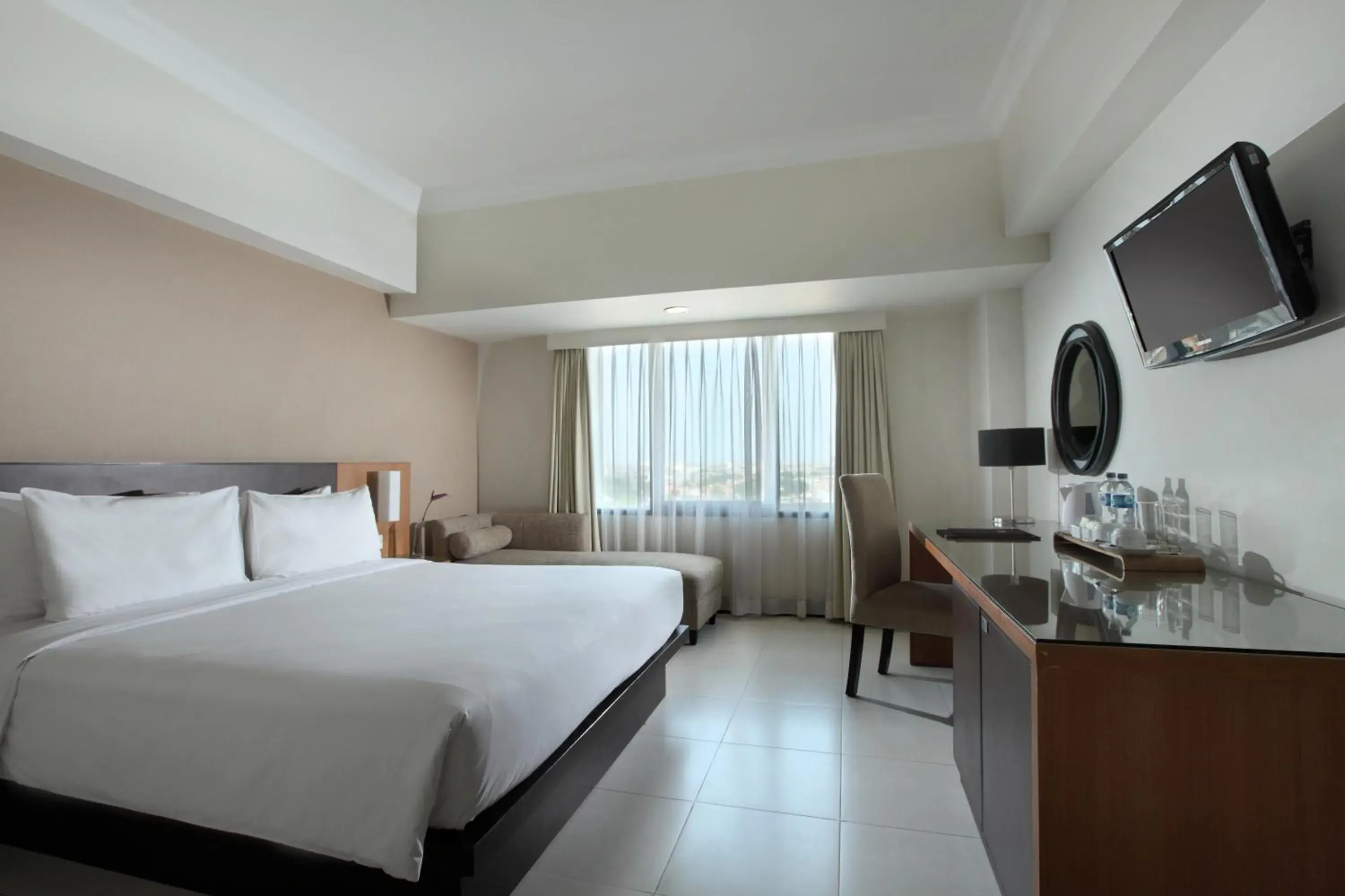 Photo of the whole room, Bed in Hotel Santika Pandegiling Surabaya