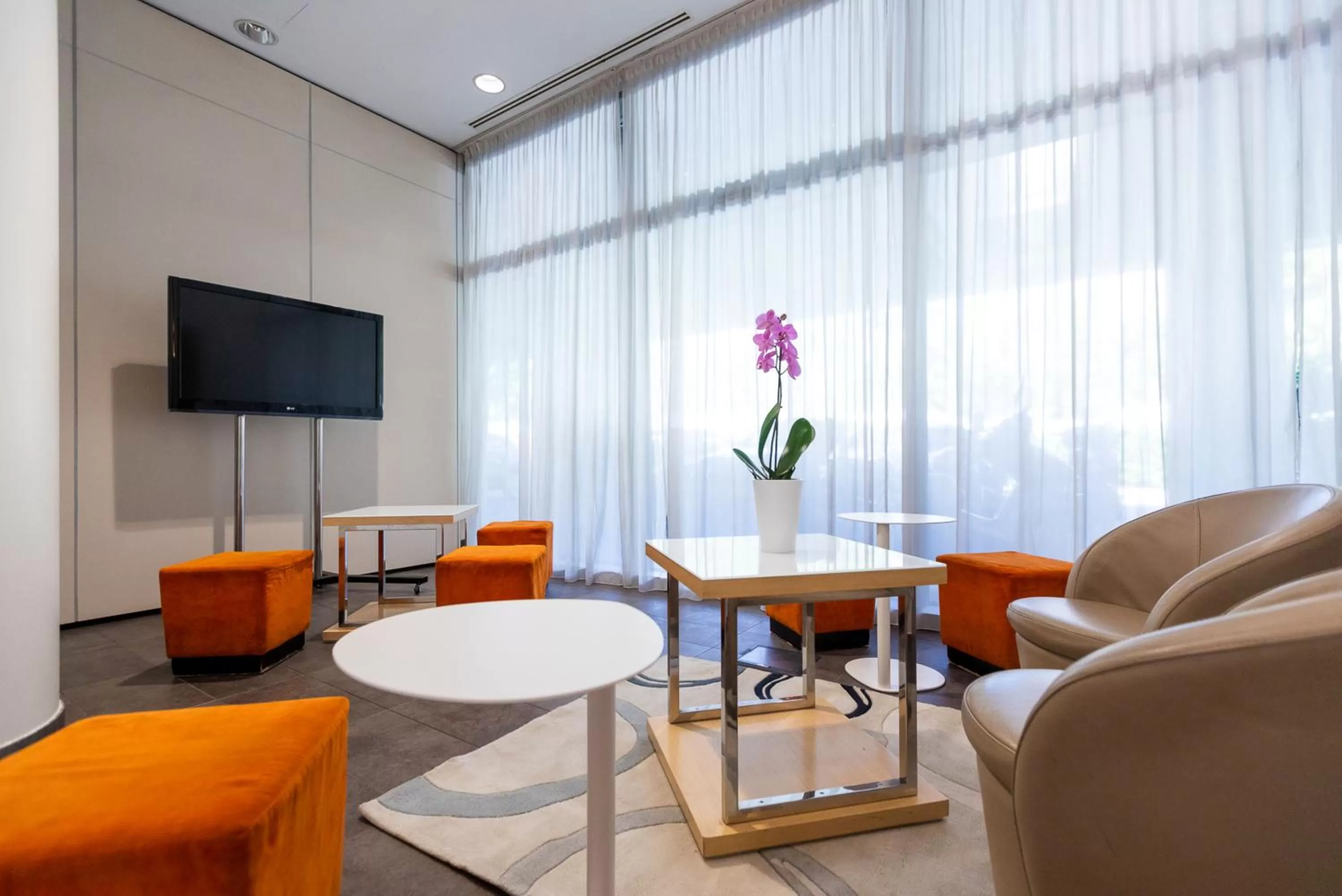 Seating area in Ramada Plaza by Wyndham Milano