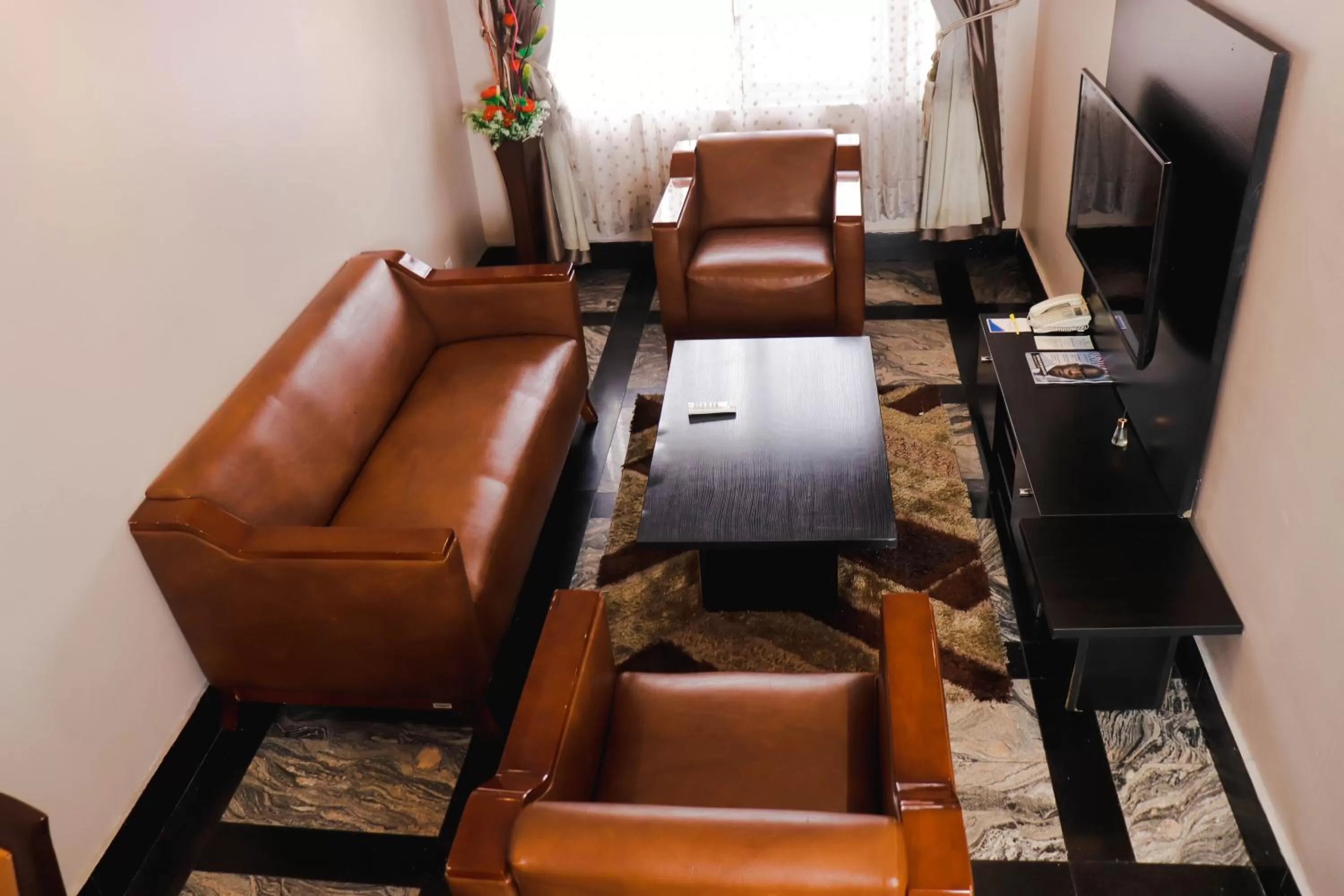 Seating area in Golden Tulip Garden City Hotel - Rivotel