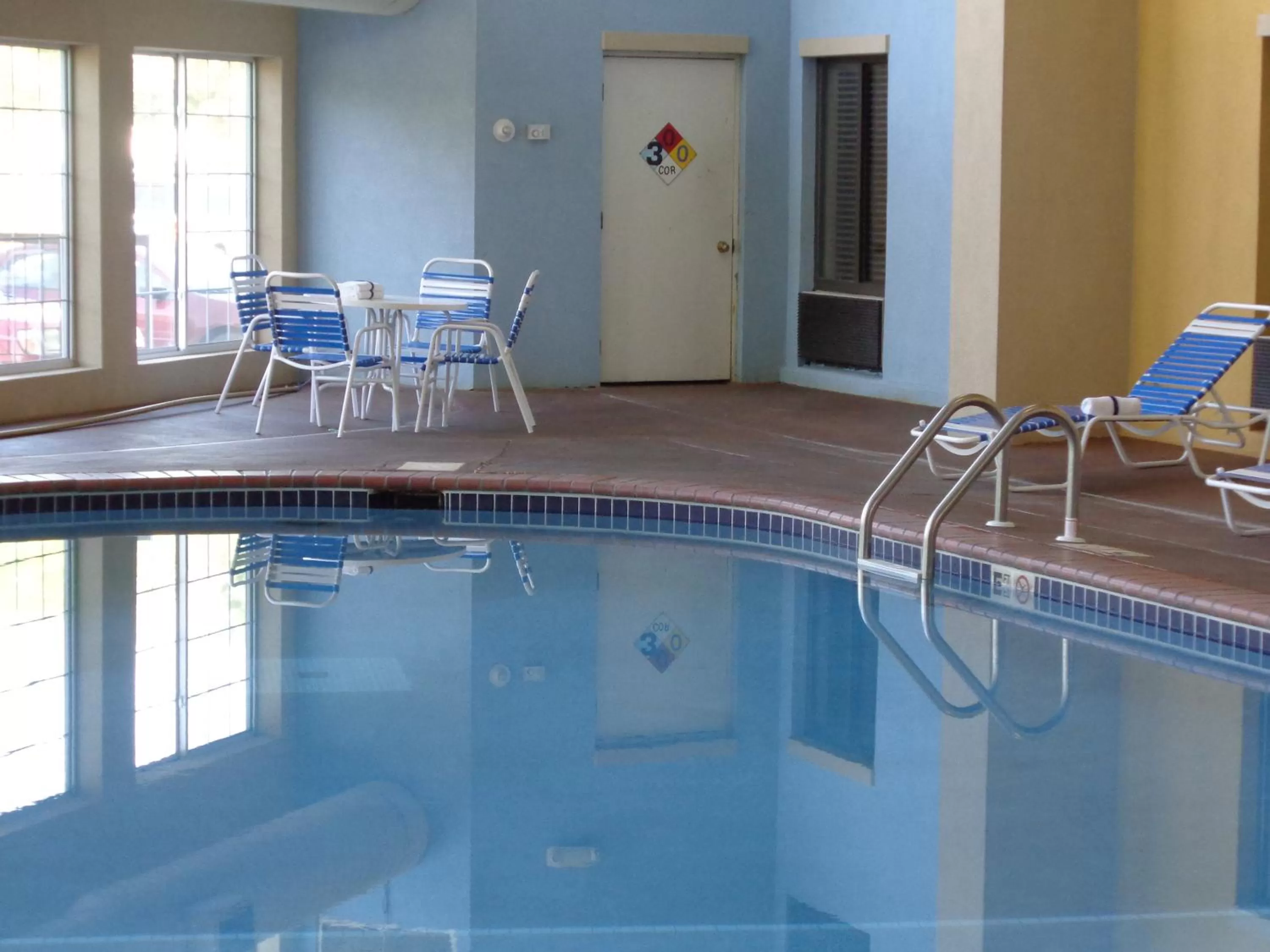 Swimming pool in AmericInn by Wyndham Johnston Des Moines