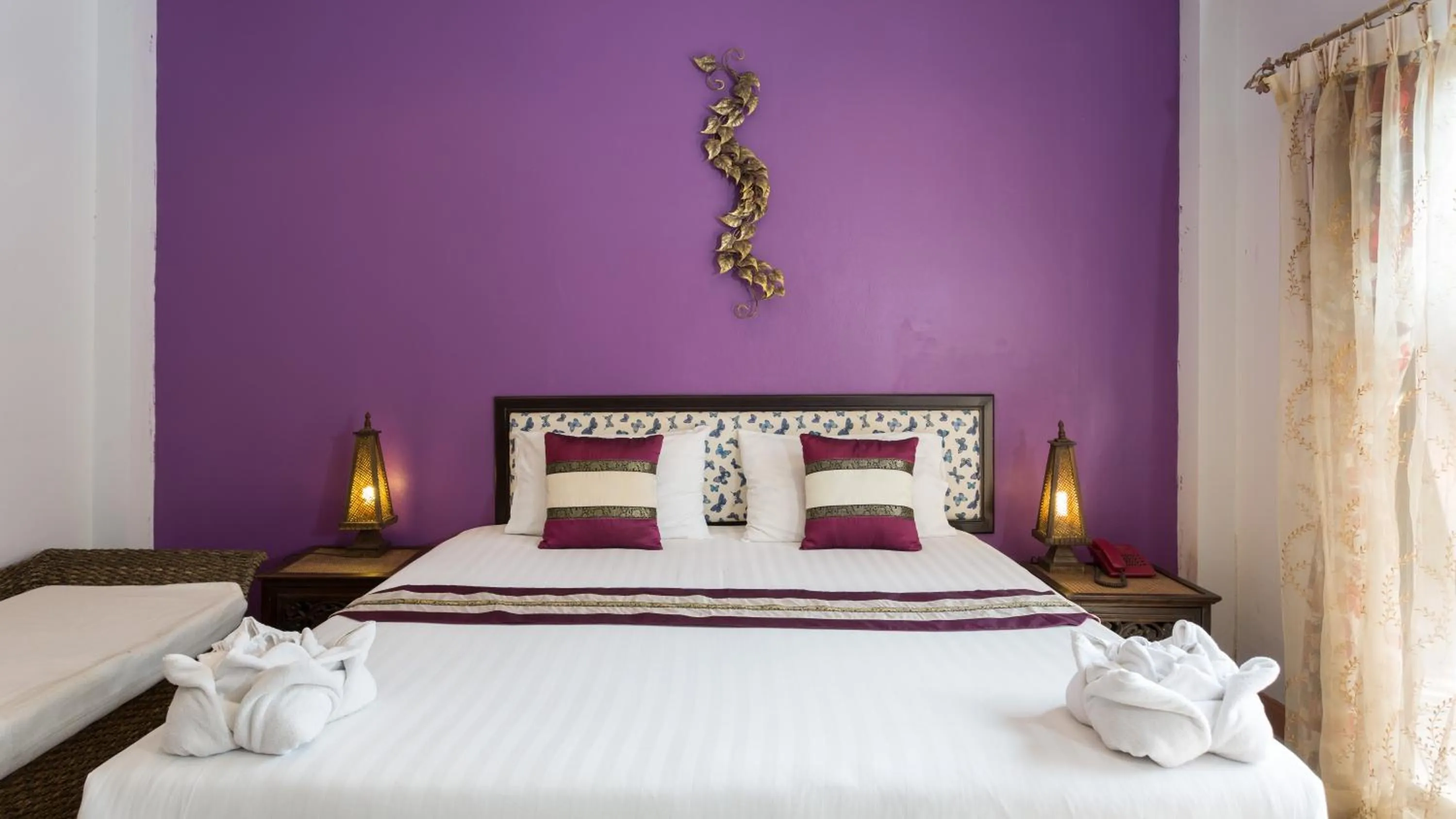 Bed in PloyKhumThong Boutique Resort