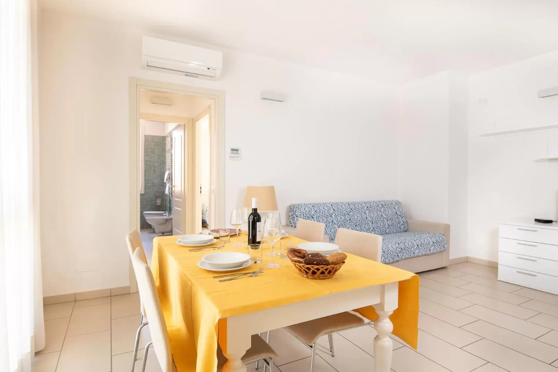 Living room, Dining Area in Residence Marina Salivoli