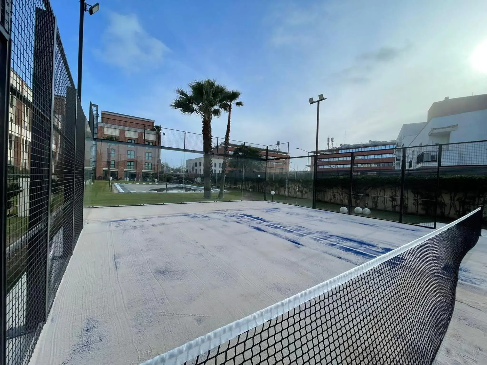 Tennis court, Swimming Pool in Mercure Leonardo da Vinci Rome Airport