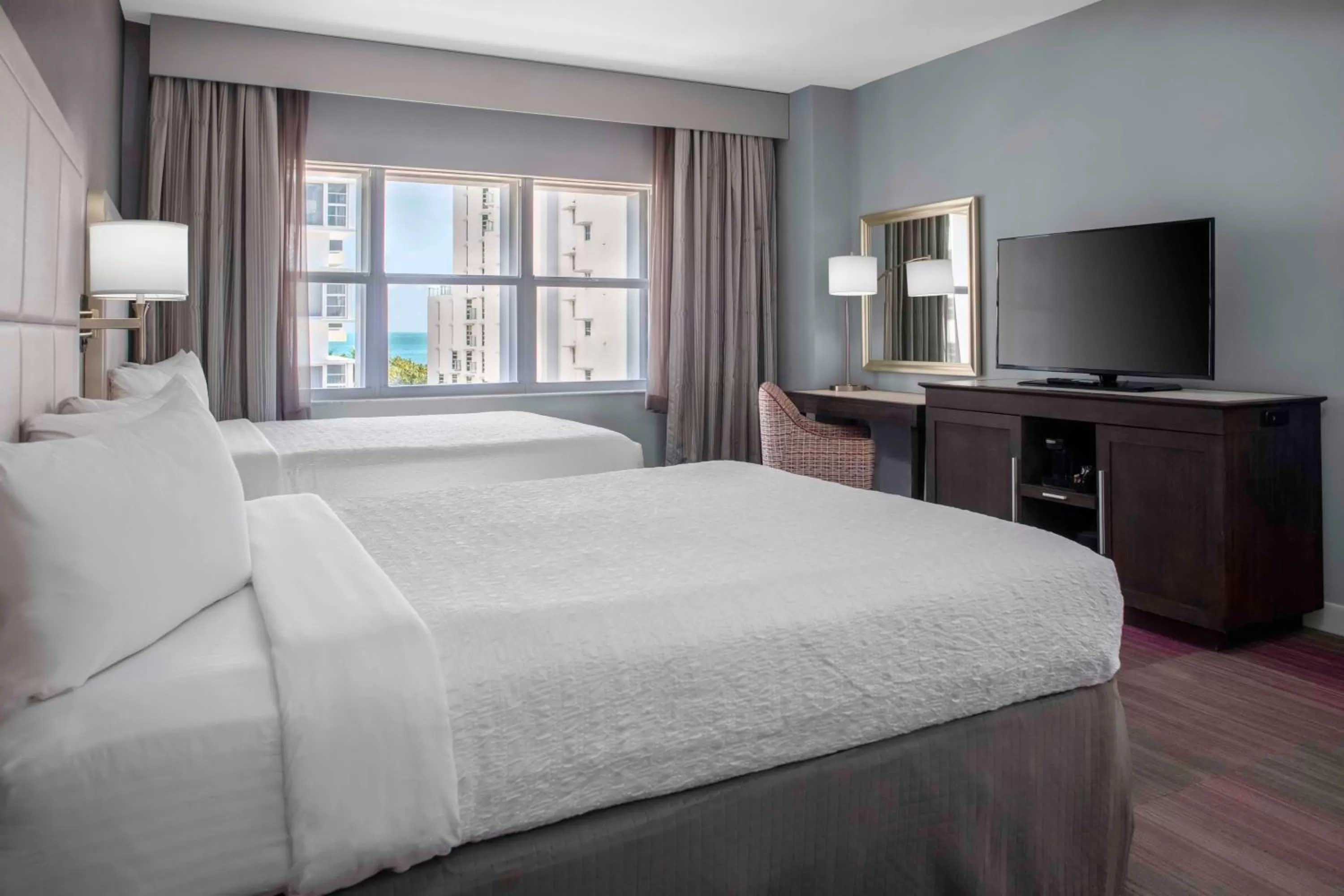 Queen Room with Two Queen Beds and Partial Ocean View in Hotel Continental Miami Beach, Tapestry Collection by Hilton