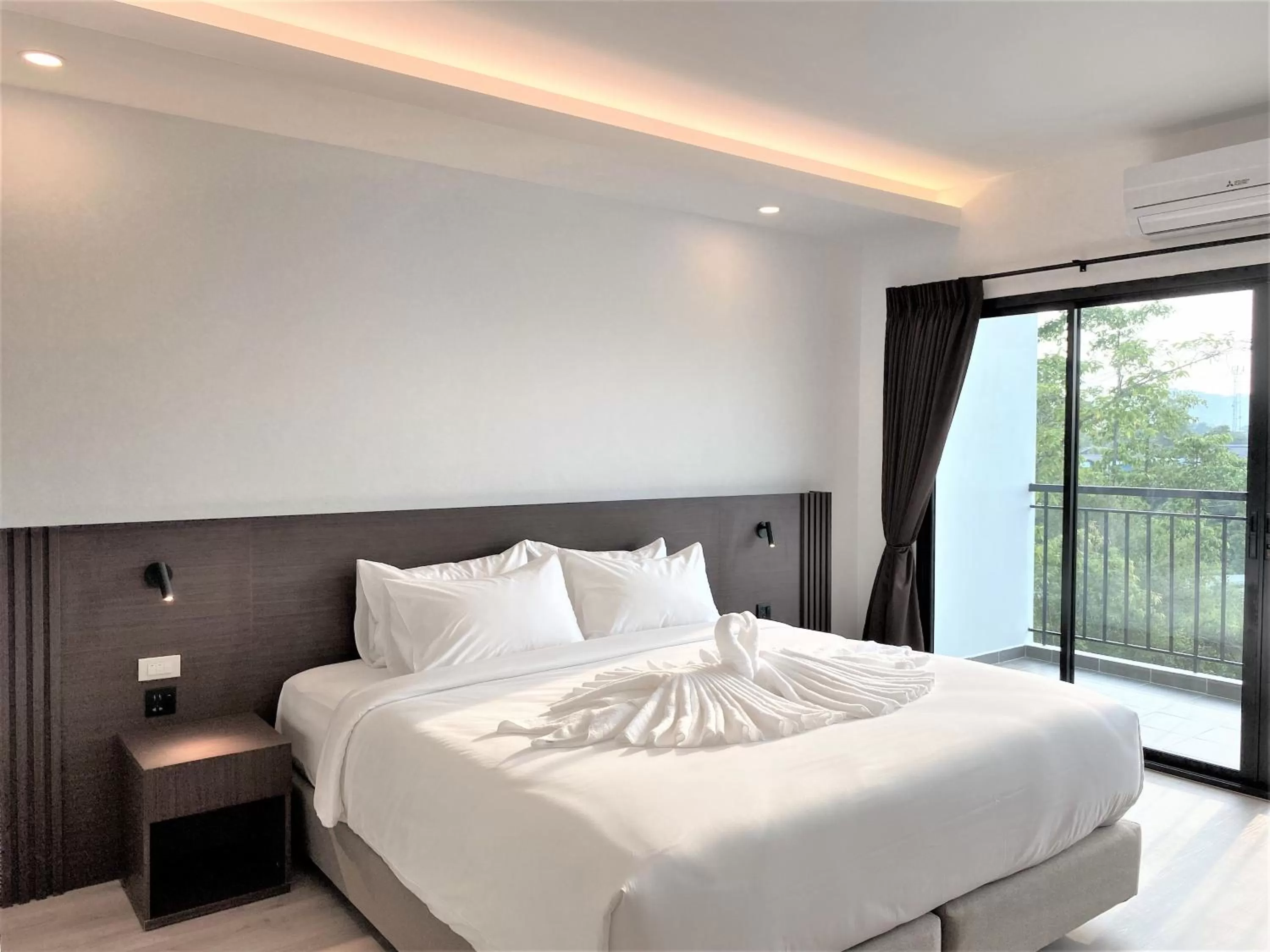 Bed in GEEN Hotel Chonburi