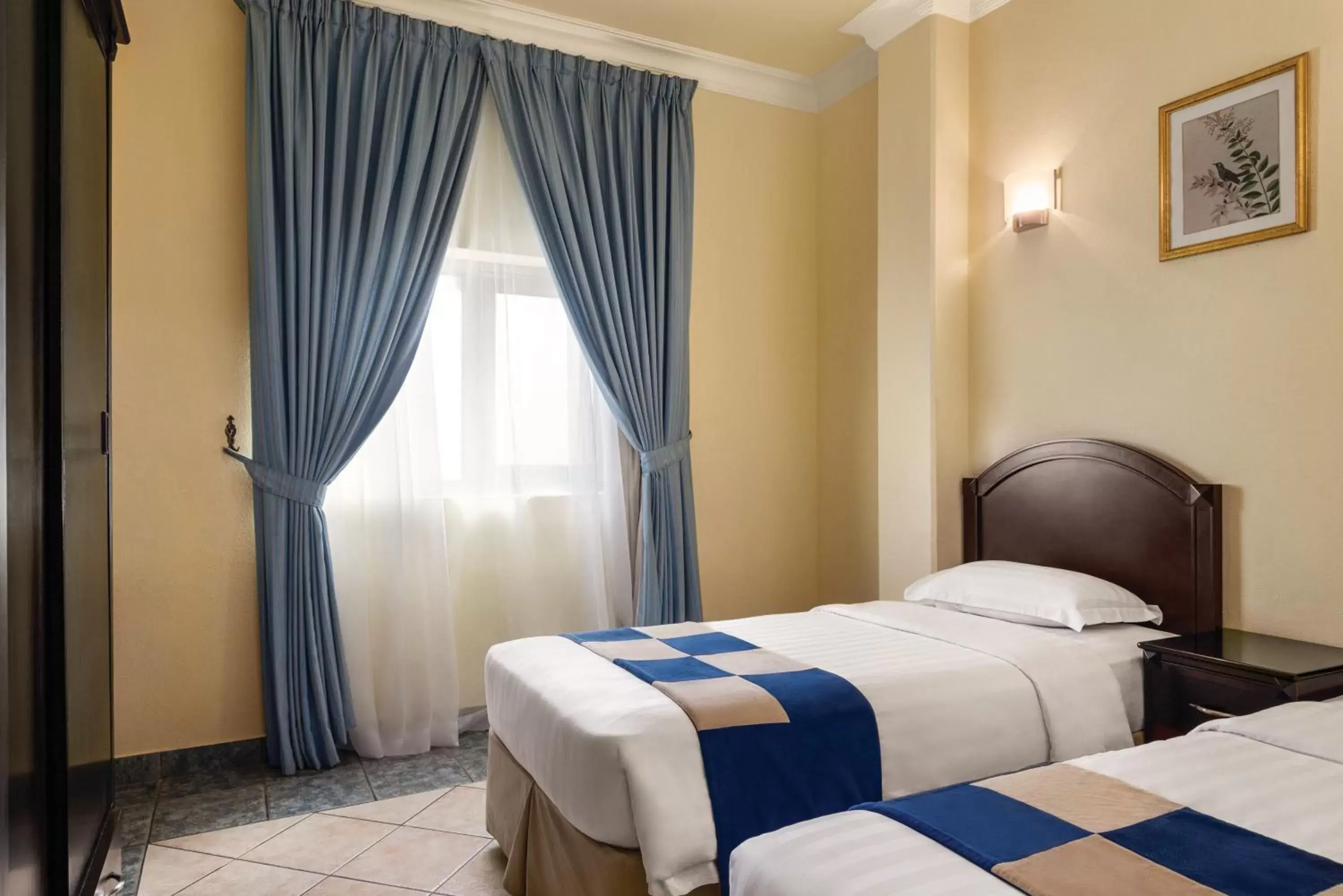 Bed in Howard Johnson Dammam Hotel