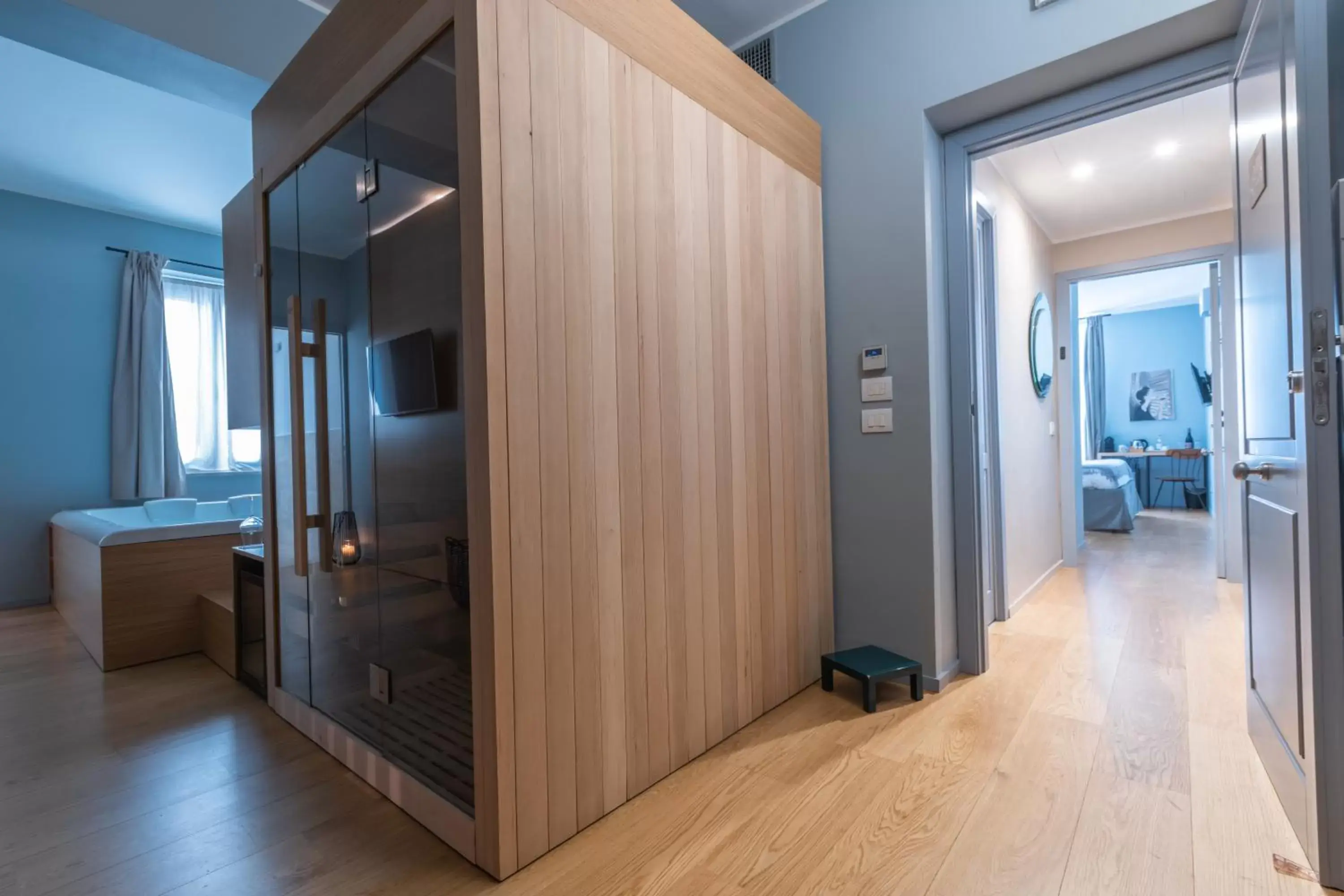 Sauna, TV/Entertainment Center in Archè Design Rooms and Suites