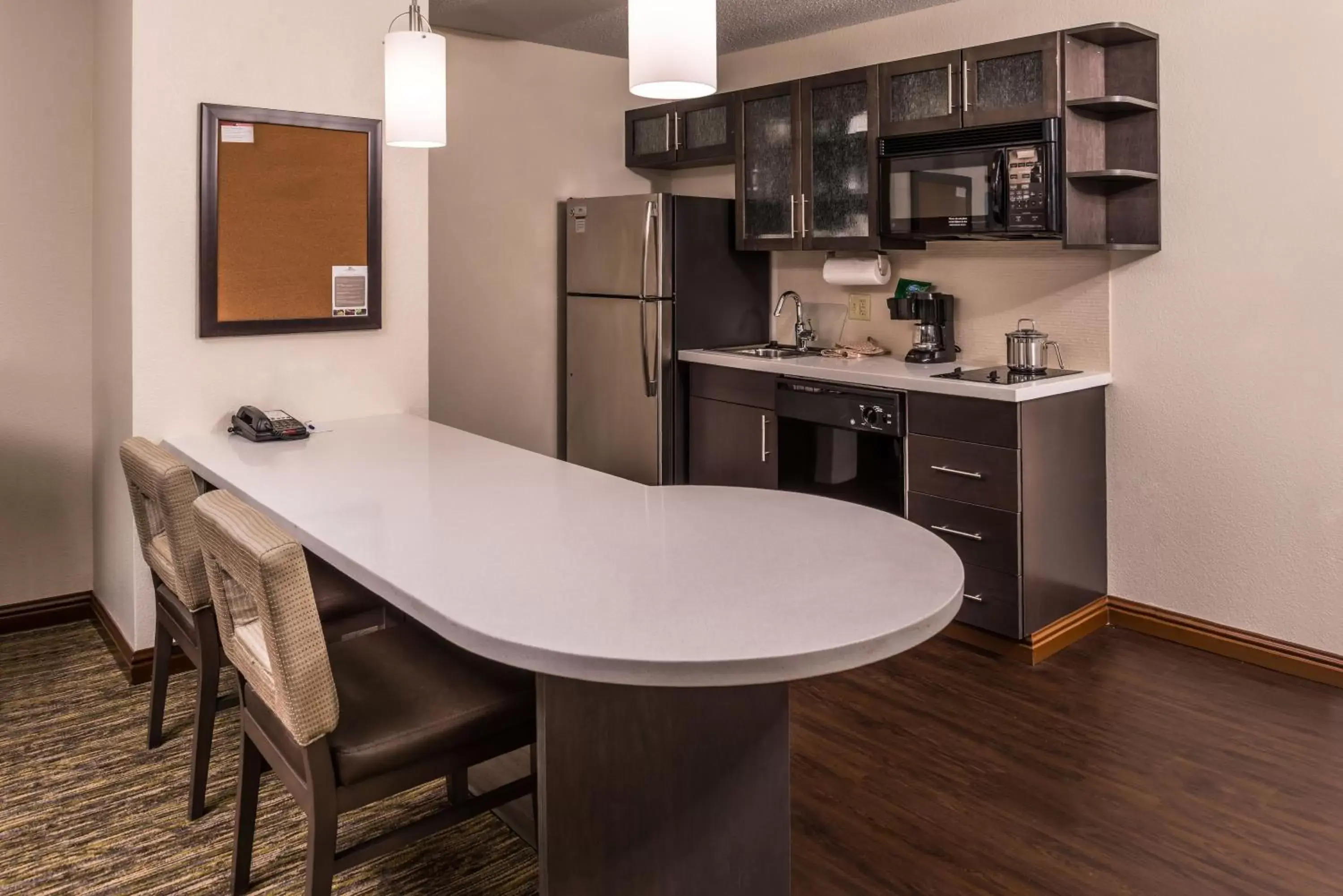 Photo of the whole room, Kitchen/Kitchenette in Candlewood Suites Kansas City, an IHG Hotel