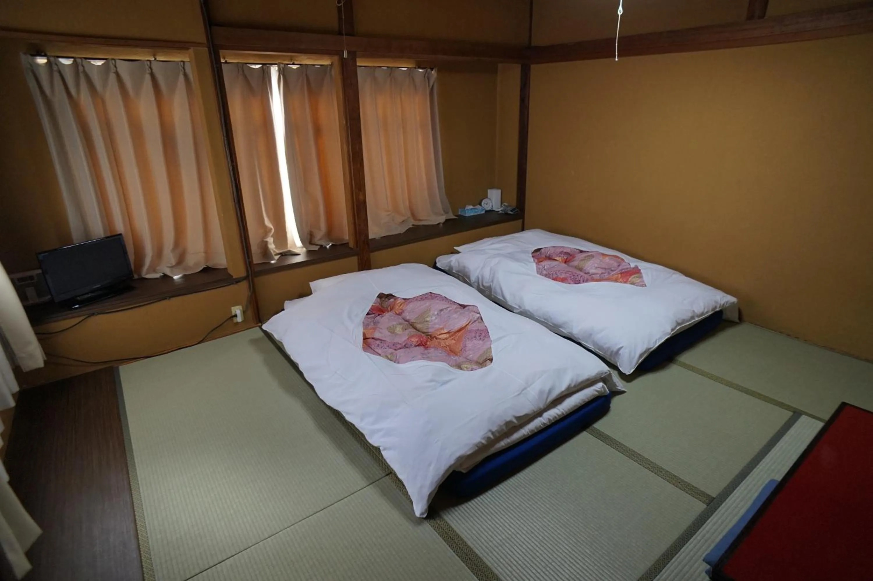 Photo of the whole room, Bed in Ryokan Katsutaro